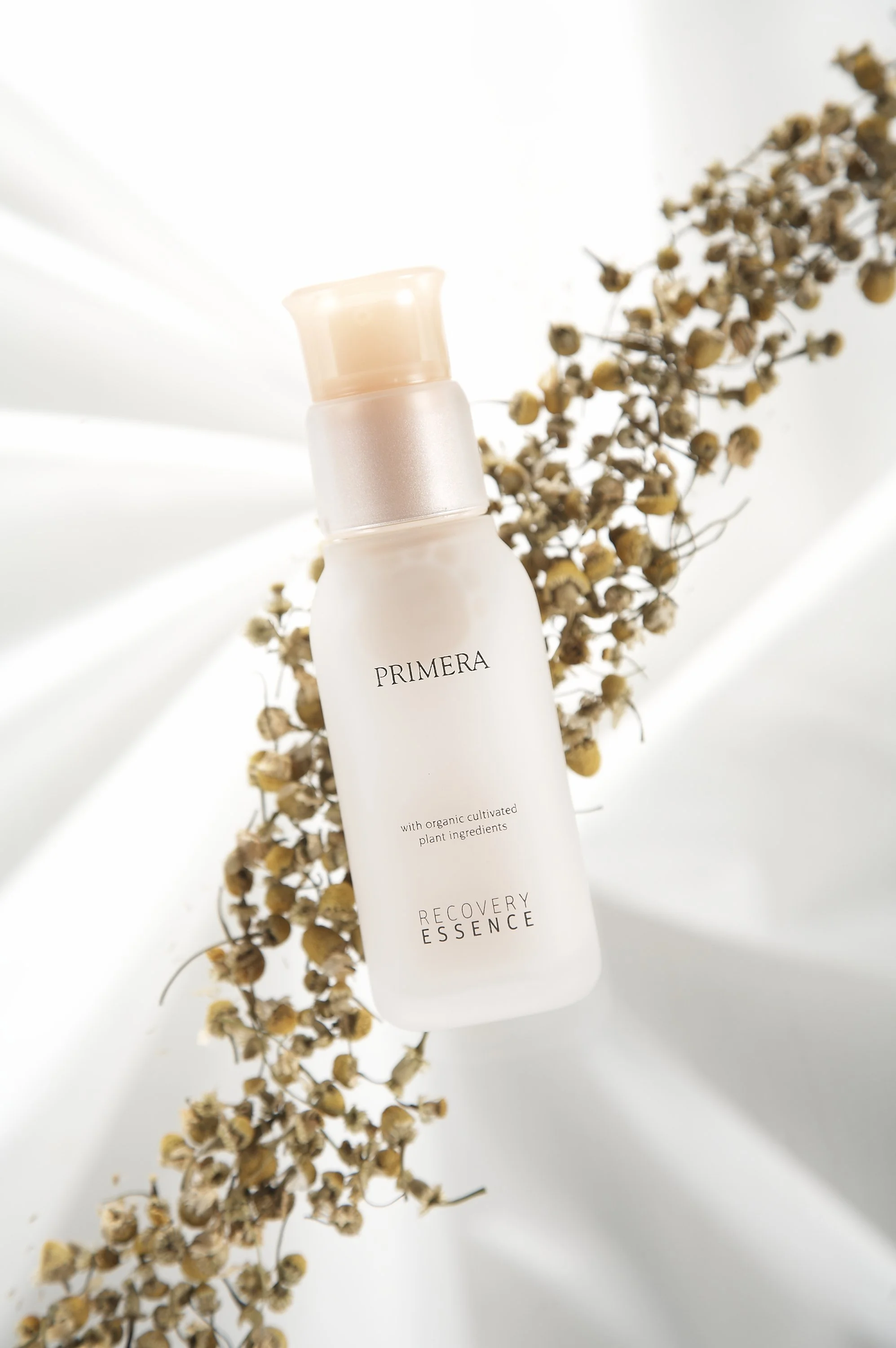 primera-recovery-essence-organic-product-overhead-dried-flower-white-fabric-01.jpg