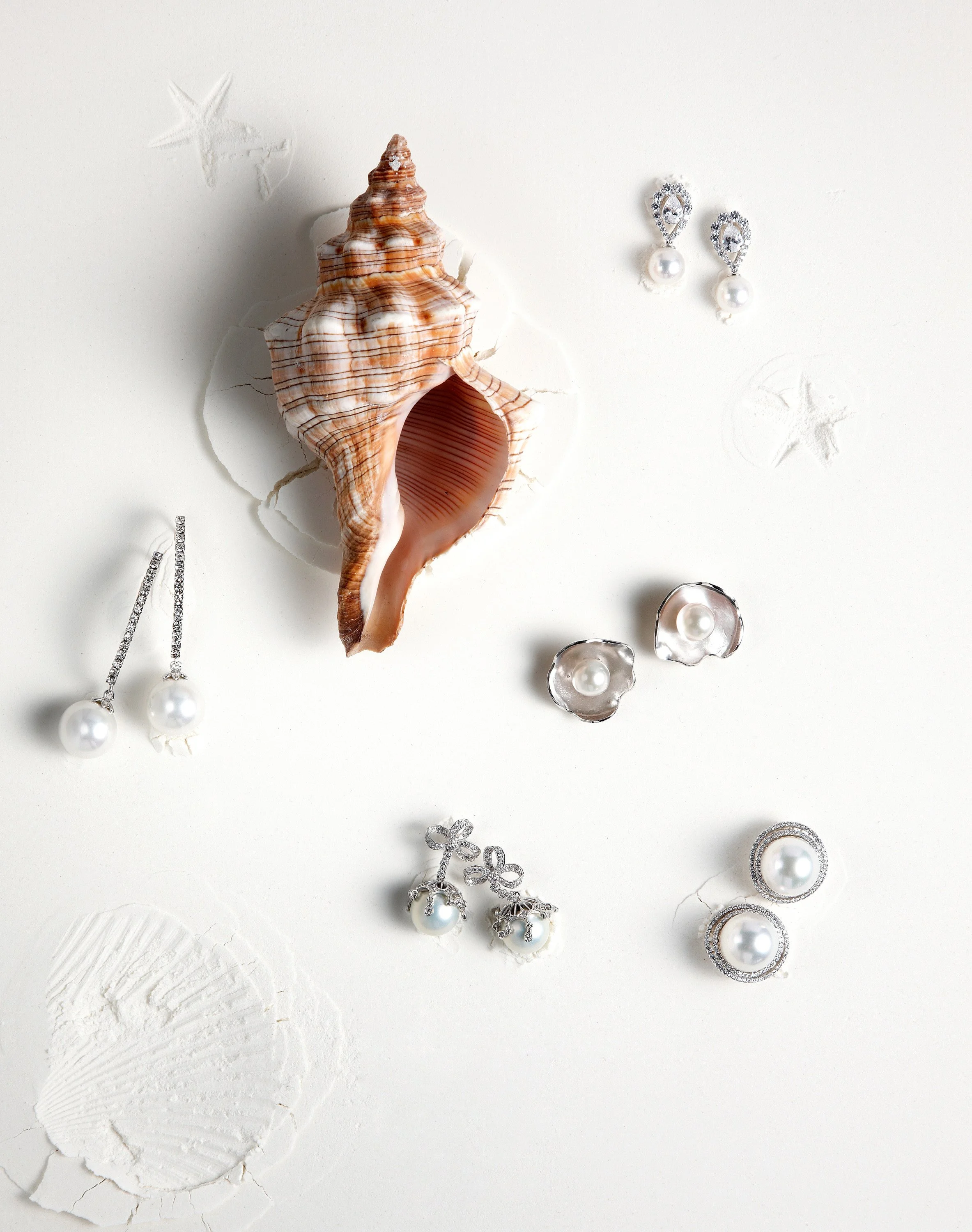 pearl-earring-collection-conch-shell-overhead-white-bg-01.jpg