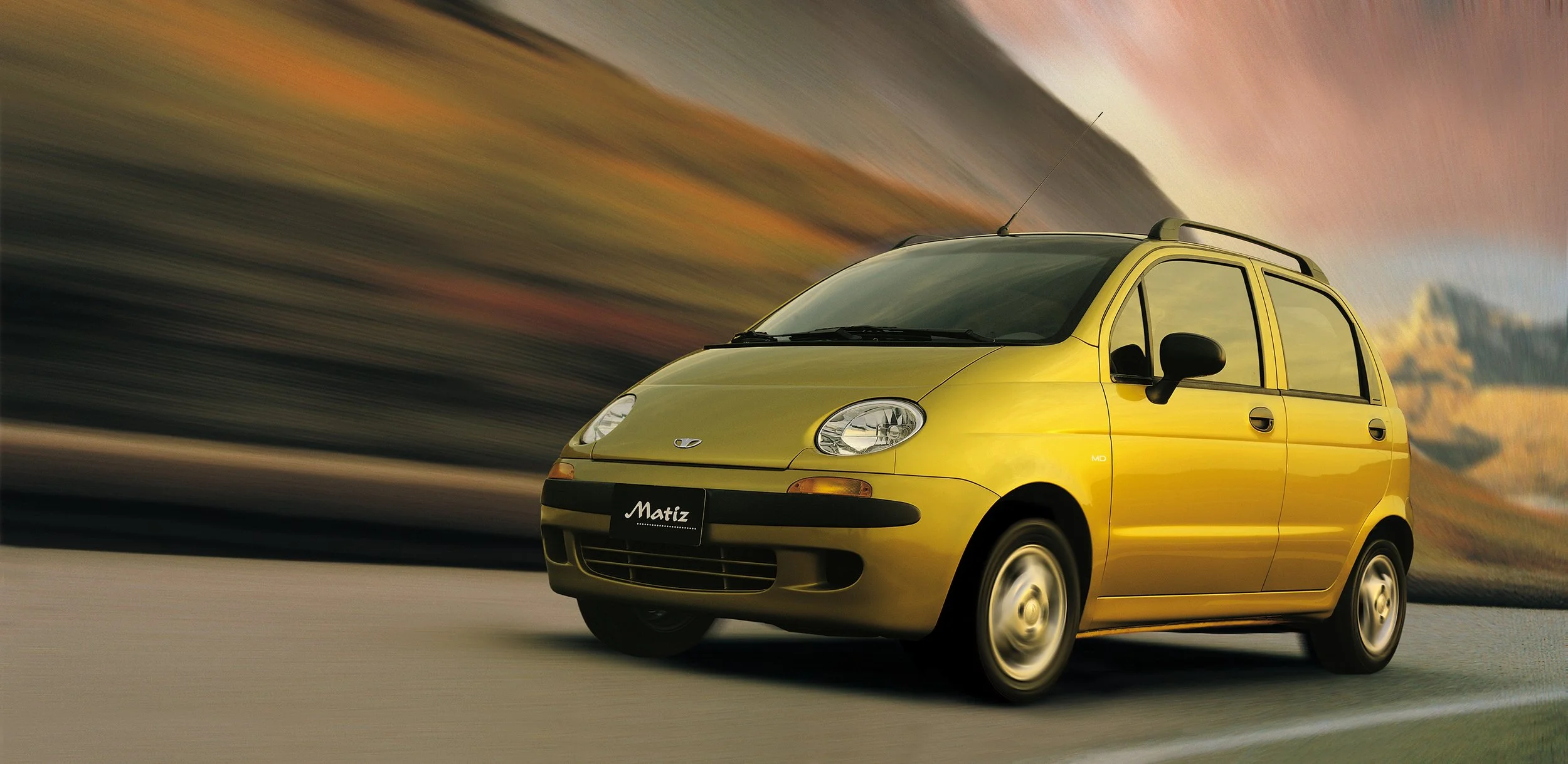 daewoo-matiz-2000s-driving-front-quarter-yellow-01.jpg