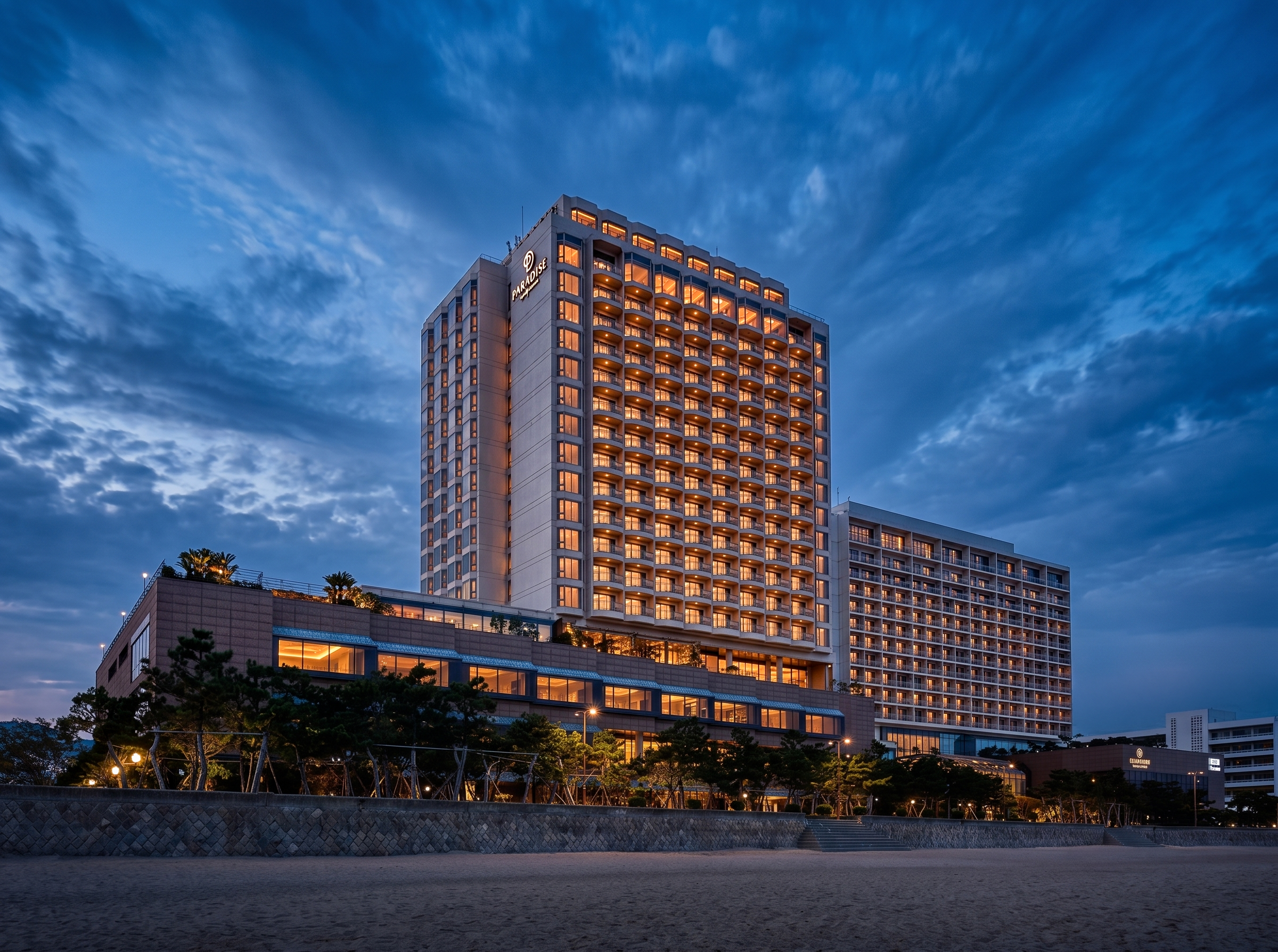paradise-hotel-busan-exterior-front-beach-twilight-blue-hour-01.png