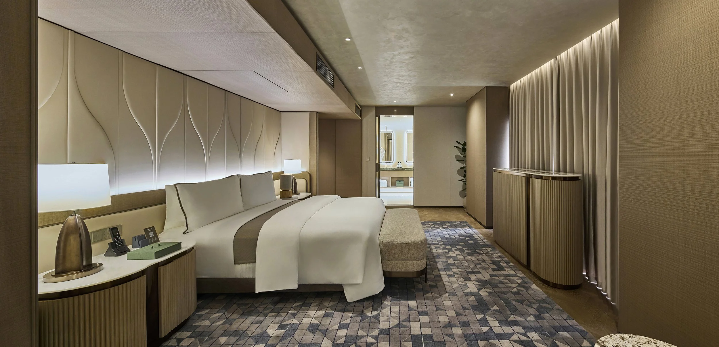 luxury-hotel-suite-bedroom-ambient-beige-tulip-headboard-geometric-carpet-06.jpg