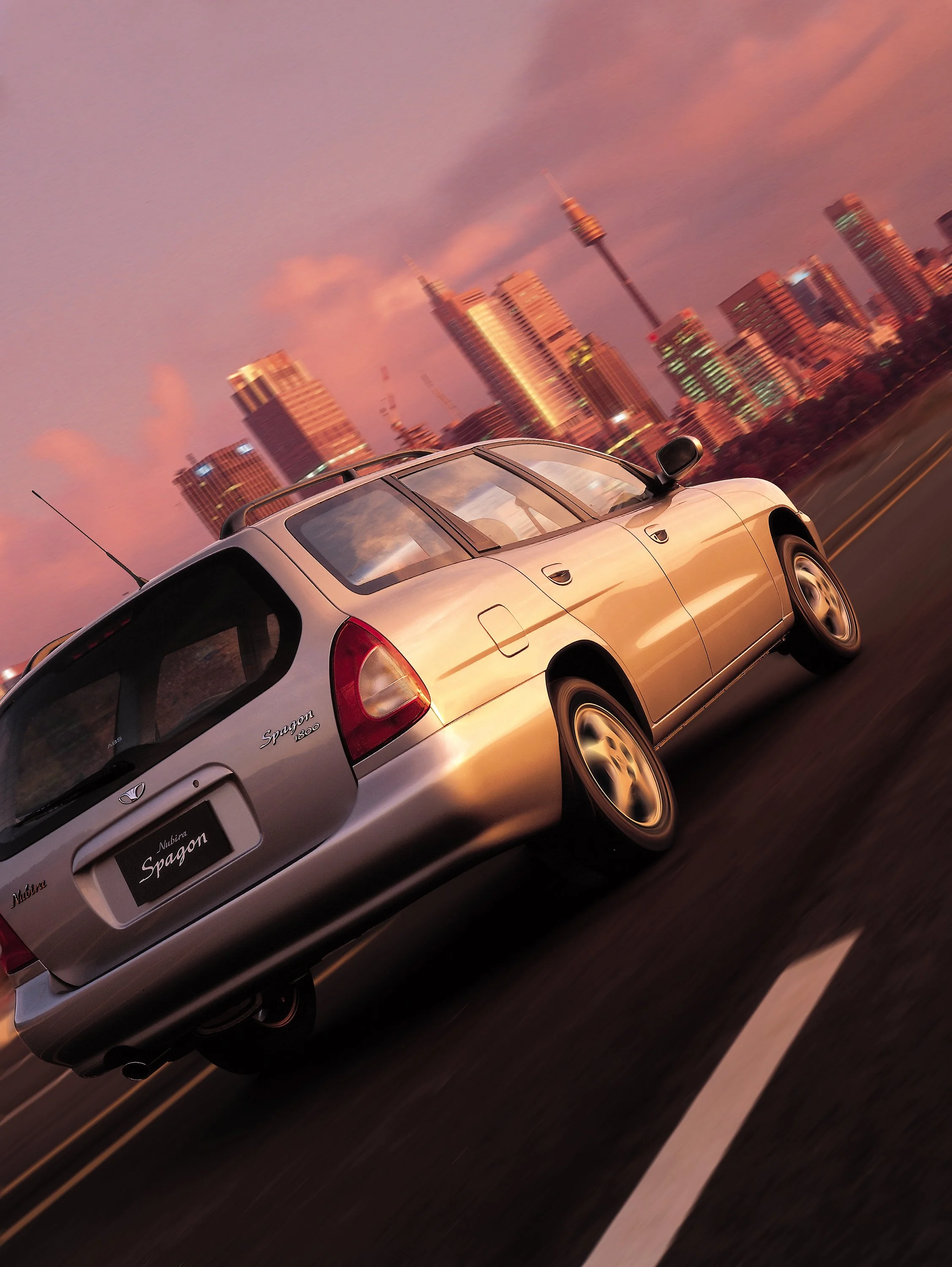 daewoo-nubira-spagon-wagon-2000s-driving-rear-silver-city-01.jpg