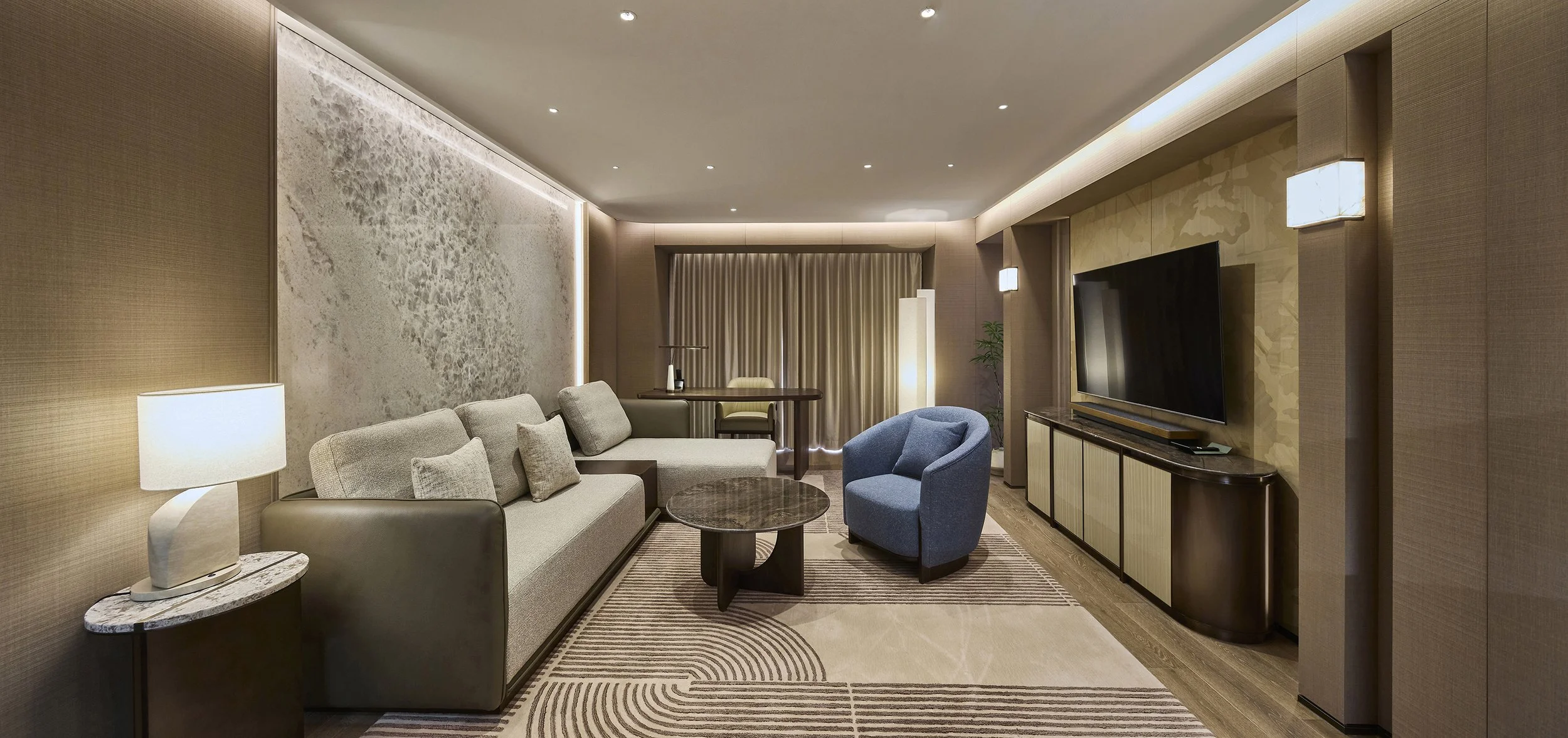 luxury-hotel-suite-living-room-ambient-beige-stone-feature-wall-04.jpg