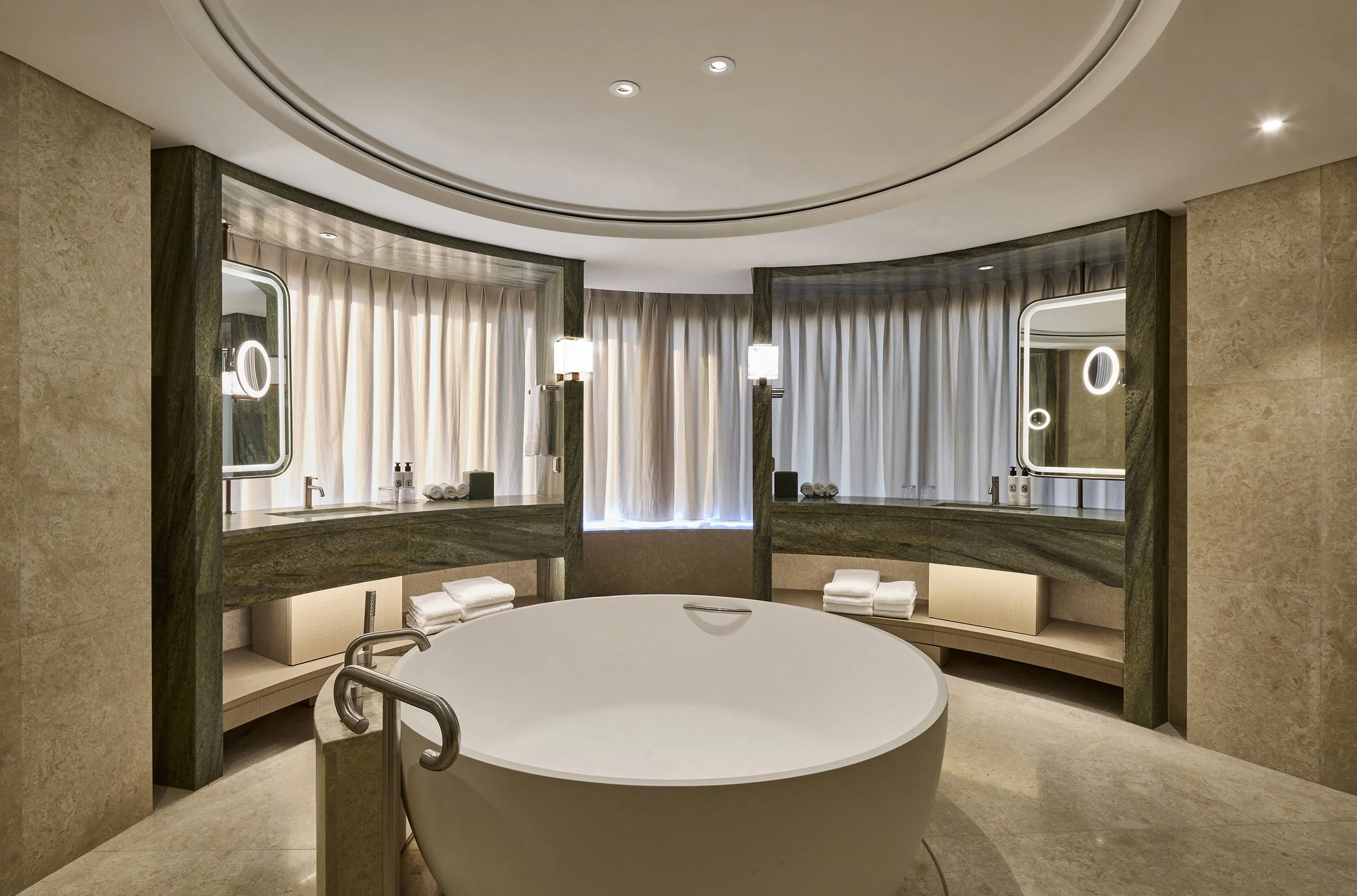 luxury-hotel-presidential-suite-bathroom-ambient-beige-circular-tub-green-marble-03.jpg