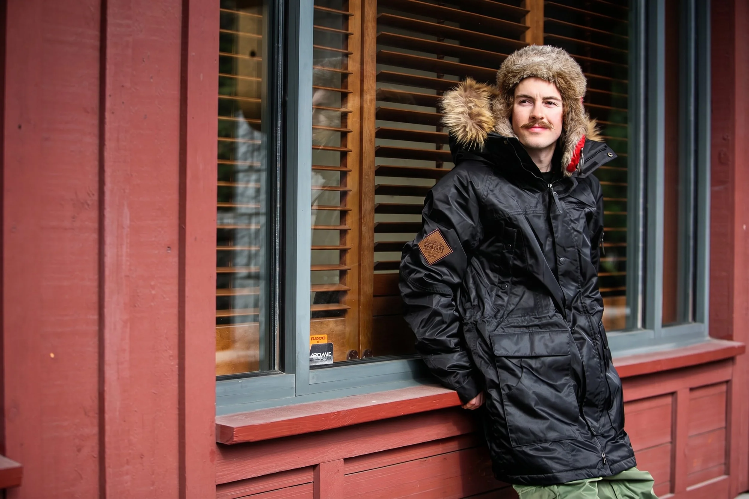 snowboard-parka-editorial-portrait-male-black-fur-hood-03.jpg