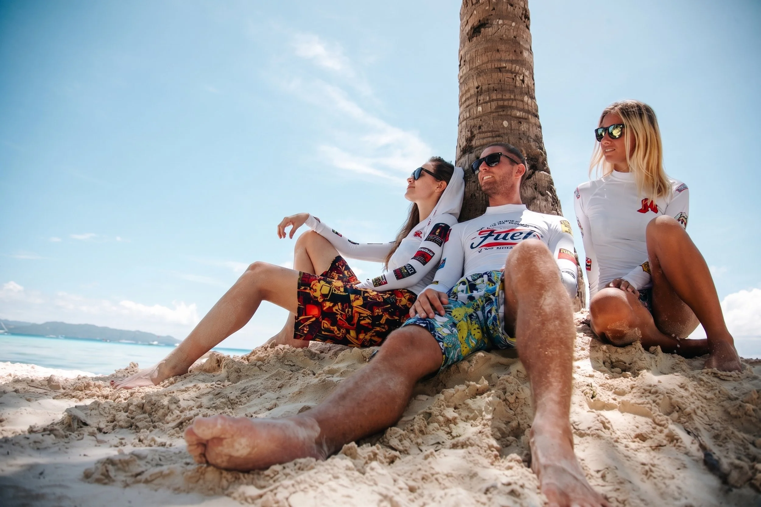 fuel-rashguard-boardshorts-lifestyle-beach-group-low-angle-white-01.jpg