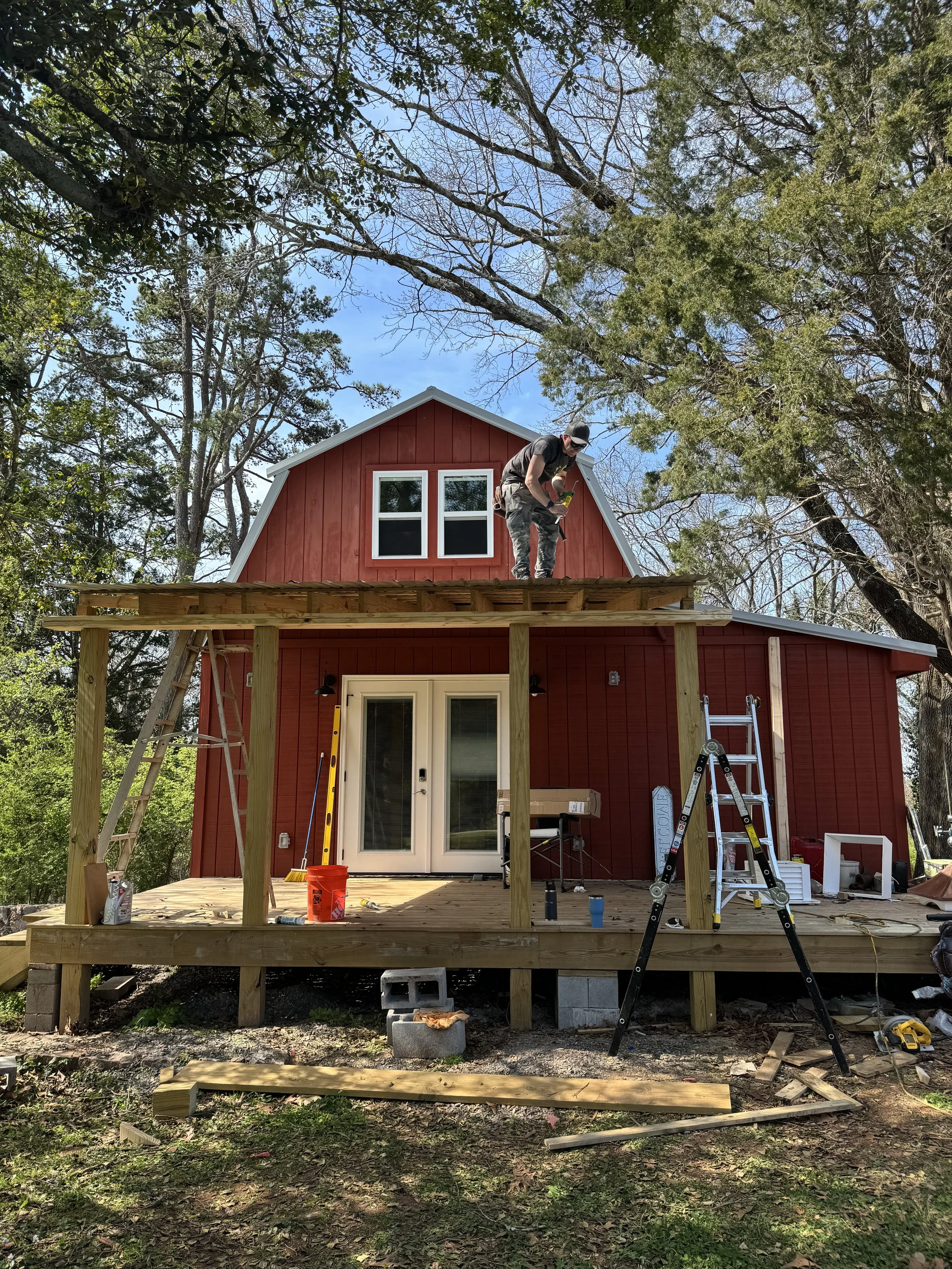 Oranssi technician working on a roof project
