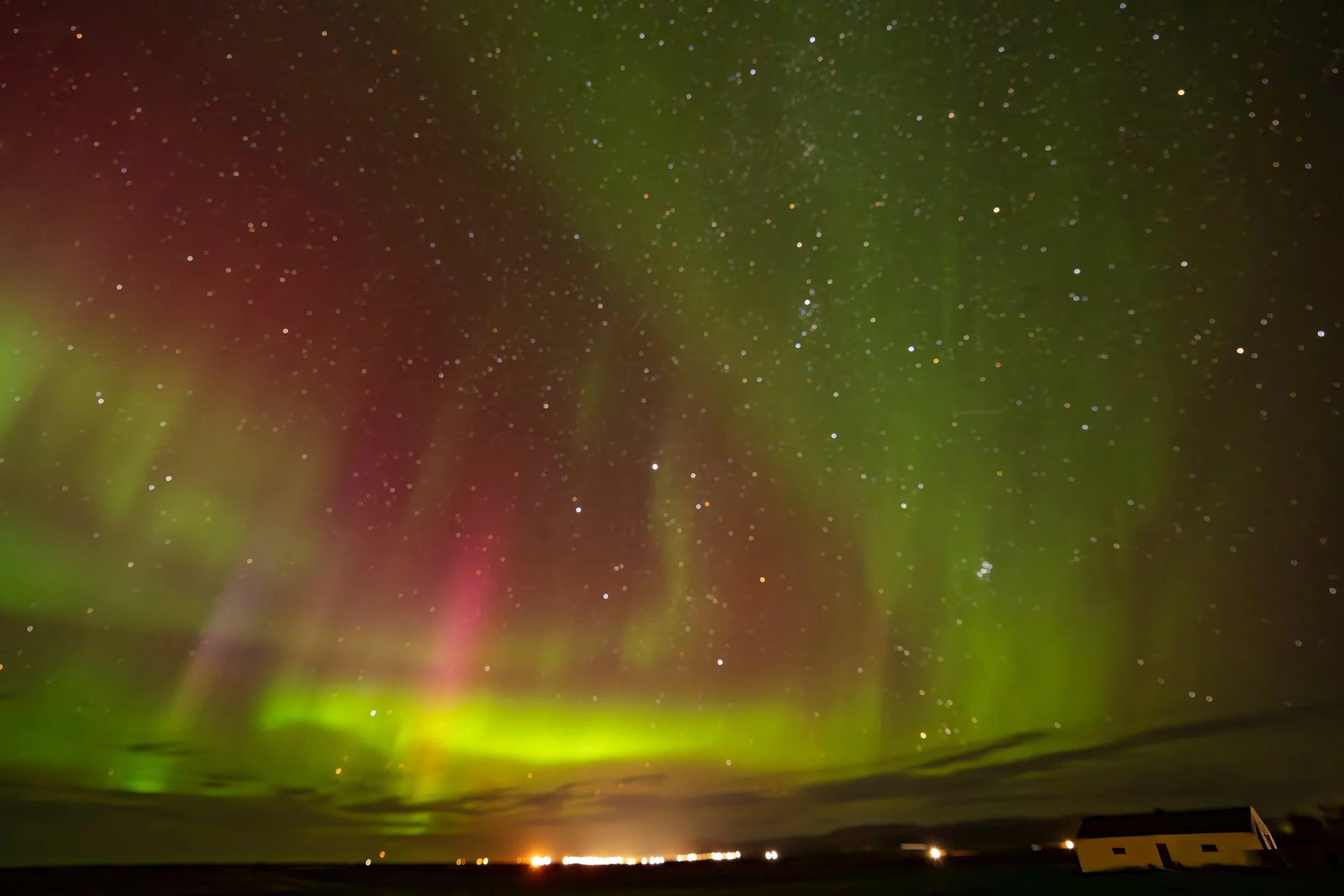 Northern lights above the landscape near Húsavík, Iceland