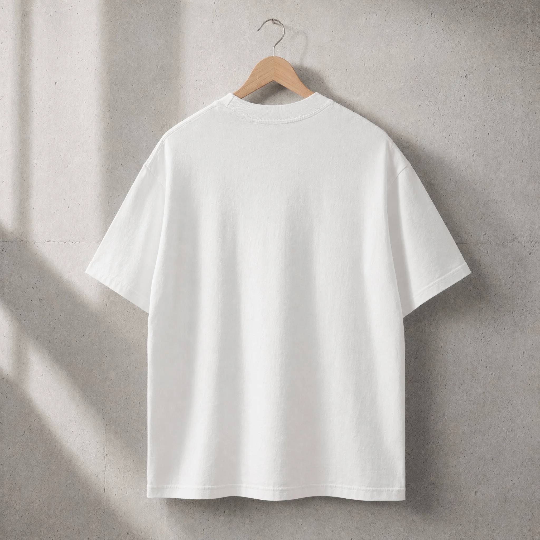 STKMN Essential Tee with boy graphic in white heavyweight organic cotton.