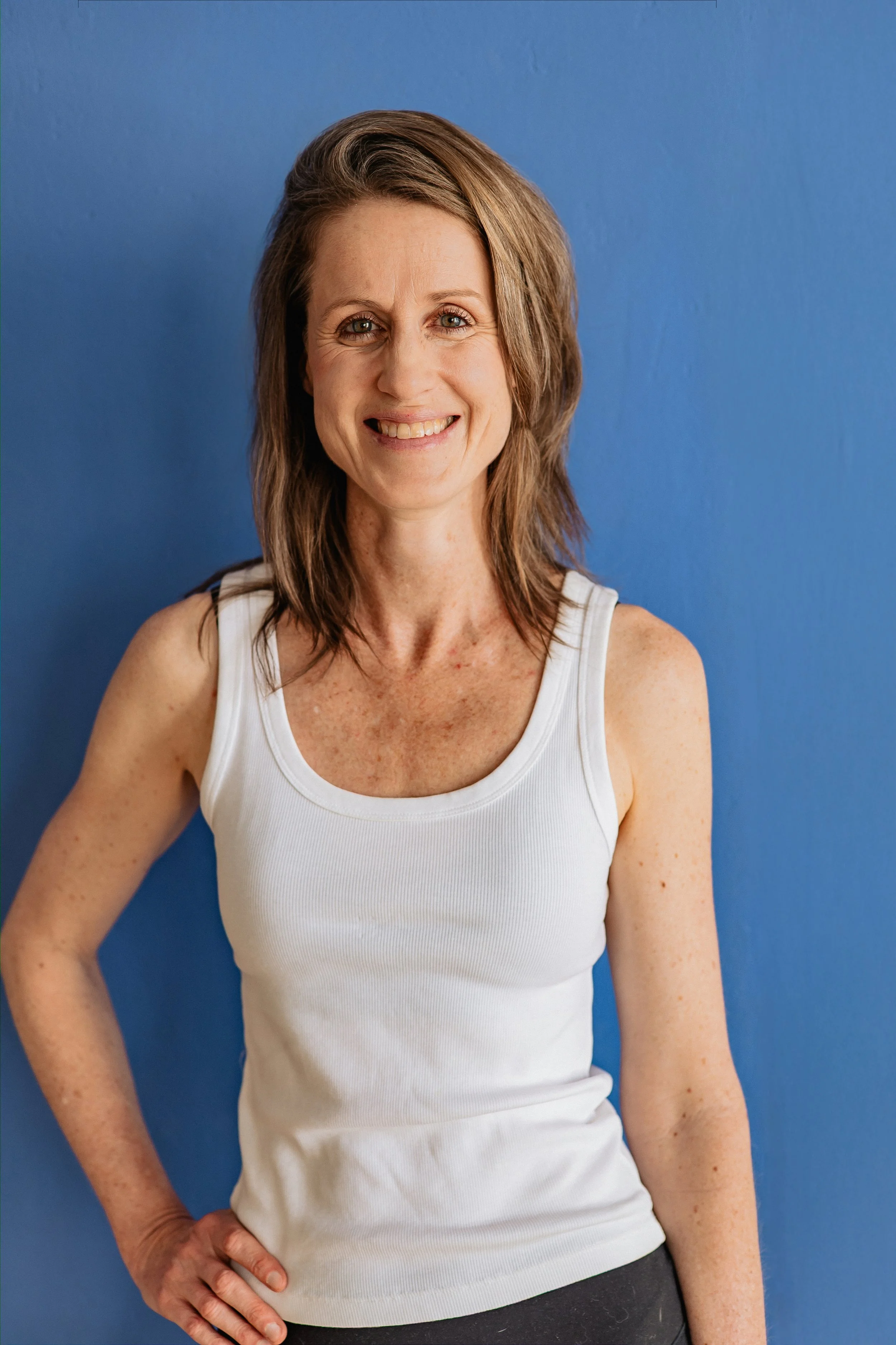 Asa is the manager and Yoga Teacher, smiling into the camera