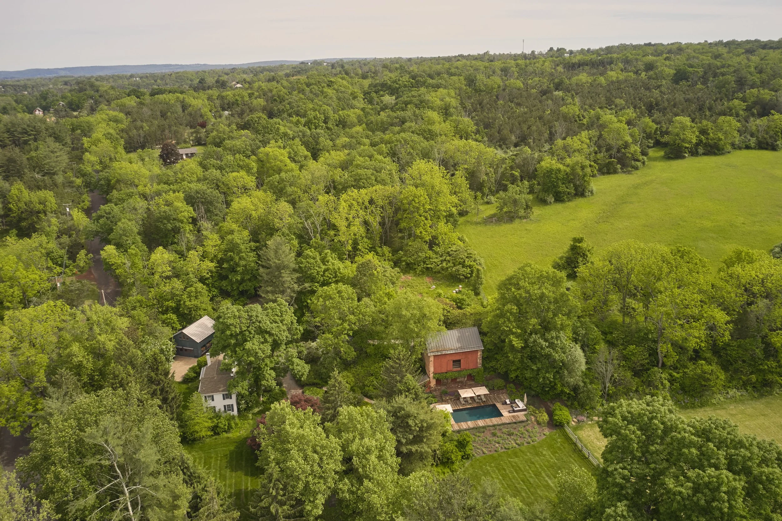 Aerial View from Left to Right.. Guest Cottage, 1850's Main House, Antique Barn and Pool