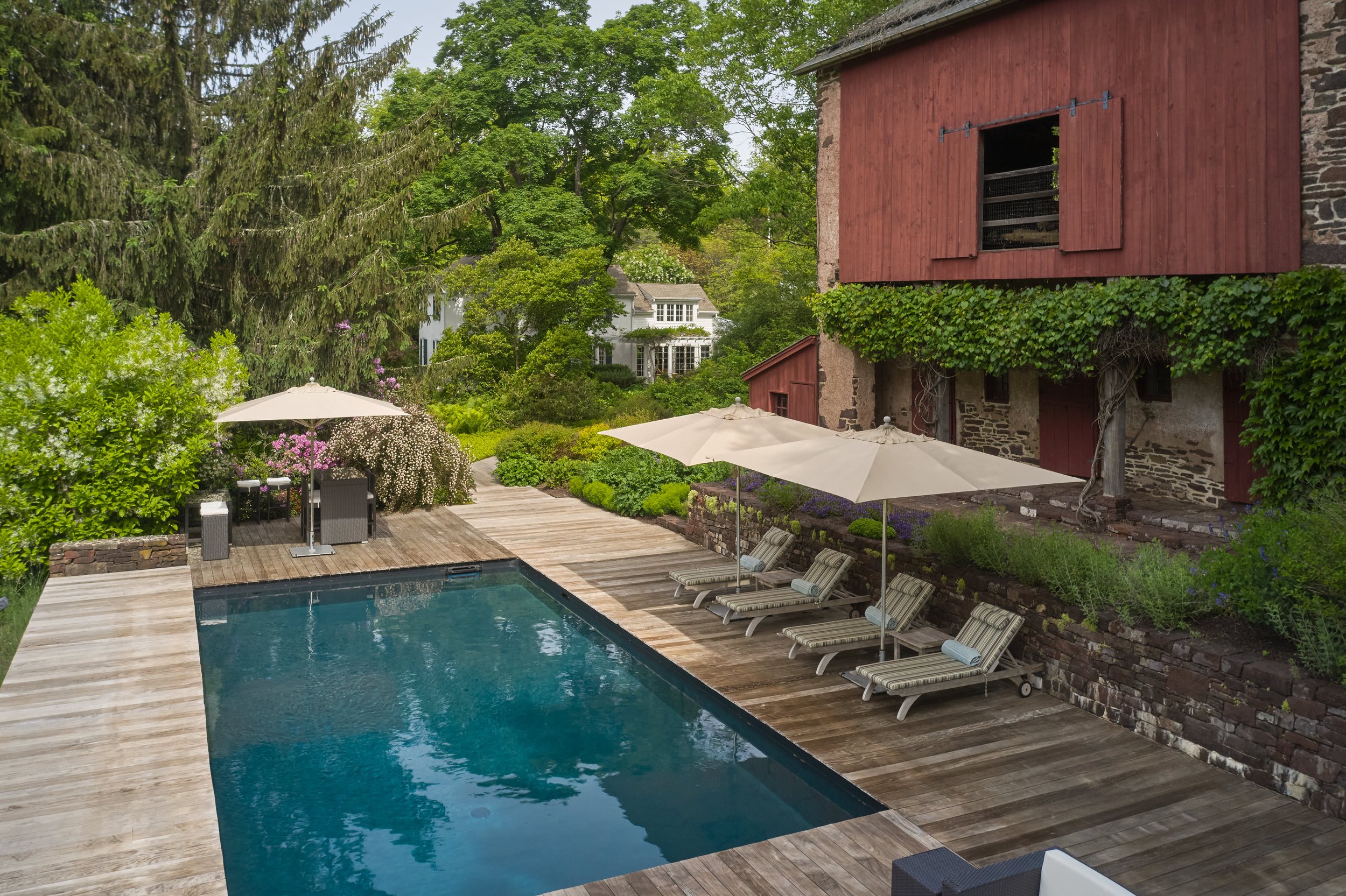 Solid IPE Pool Deck and Antique Stone Milking Barn