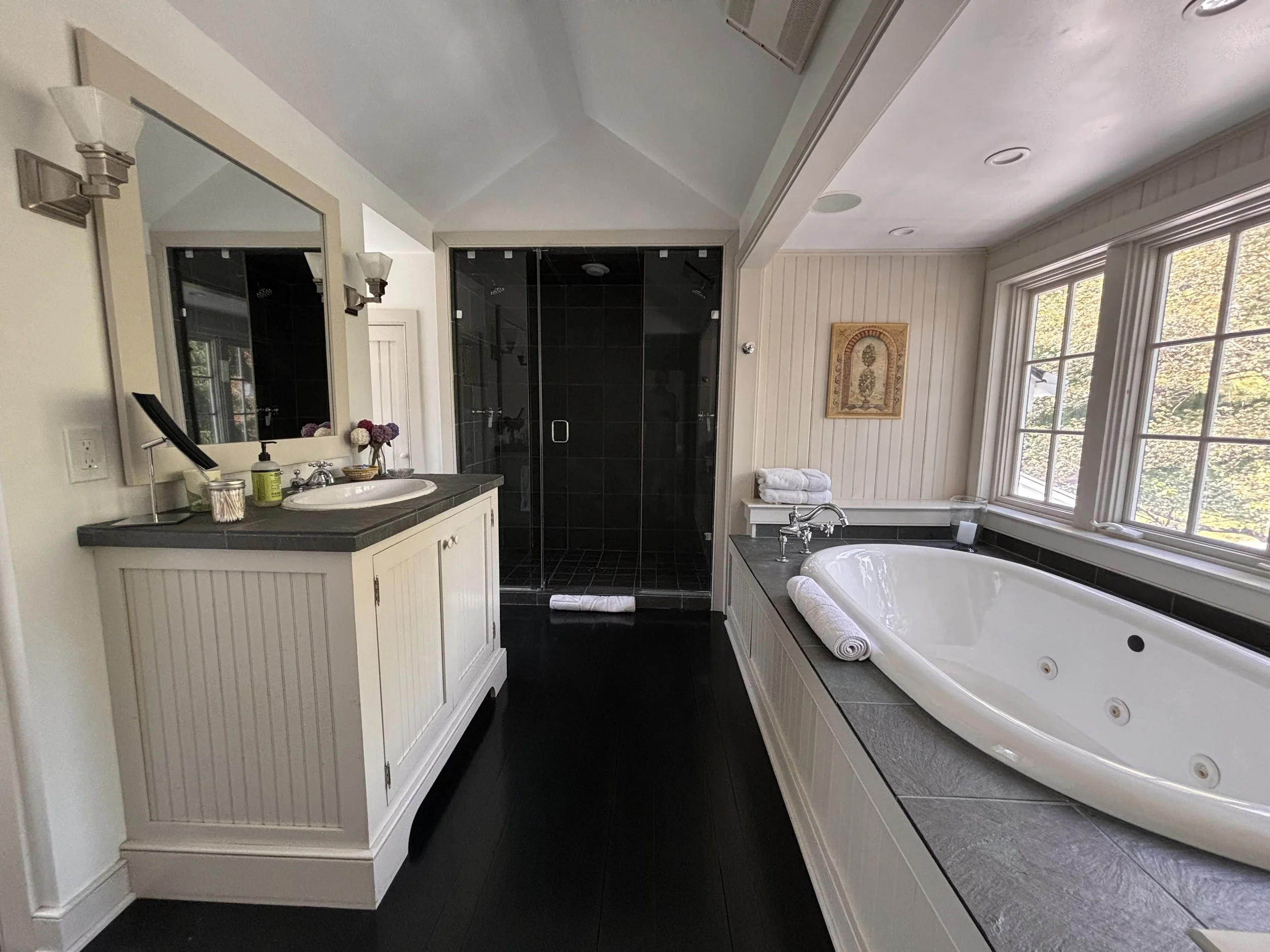 Full Bathroom with Two-Person Whirlpool Soaking Tub, Double Shower, and Spa Steam Shower in Main House
