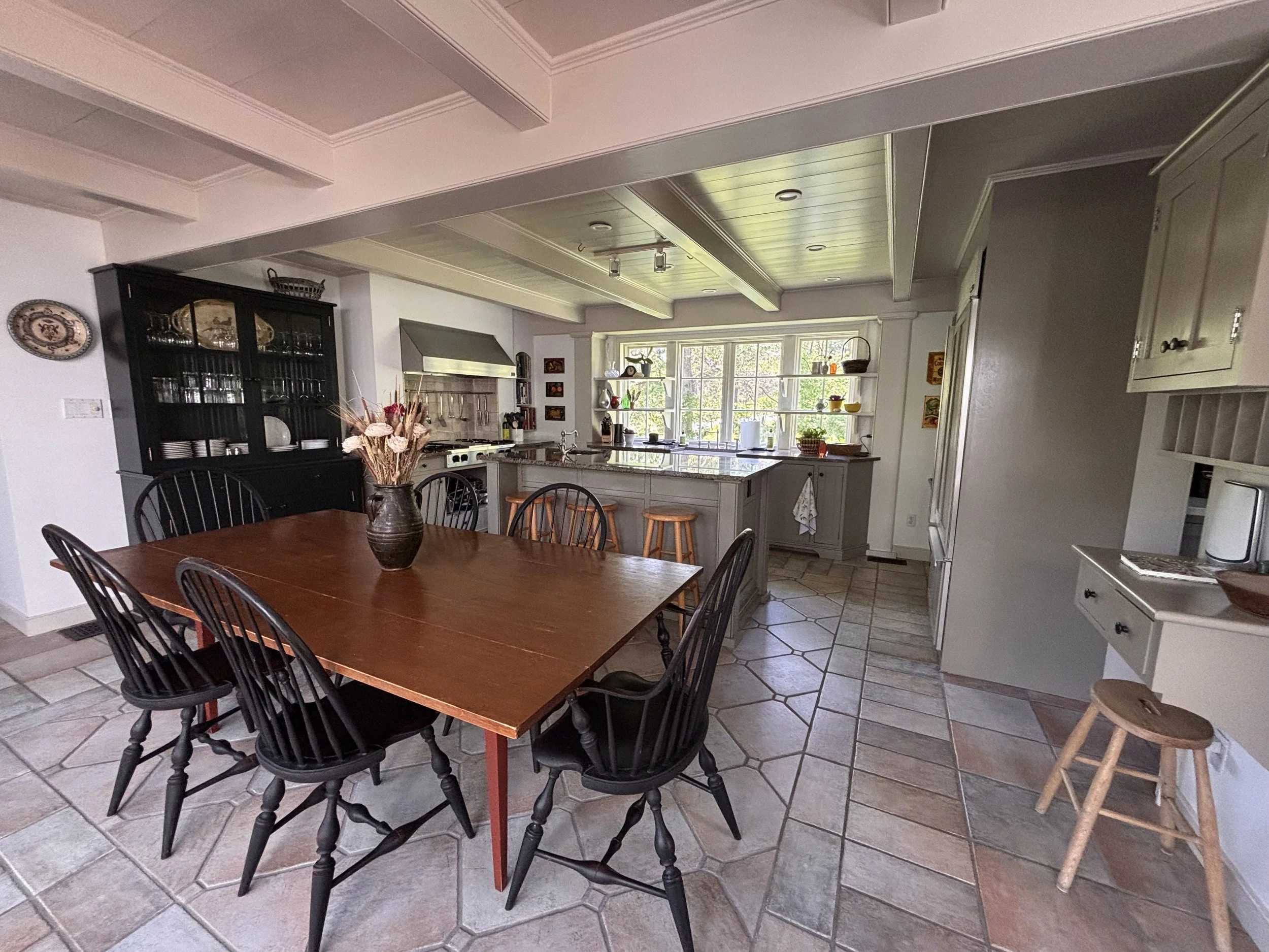 Stunning Eat-In Kitchen with a Granite Island, Seating for 8, Sub-Zero Refrigerator, Thermador Double Oven, and Five Star Range — Ready to Inspire Gourmet Cooking with Fresh Local Ingredients