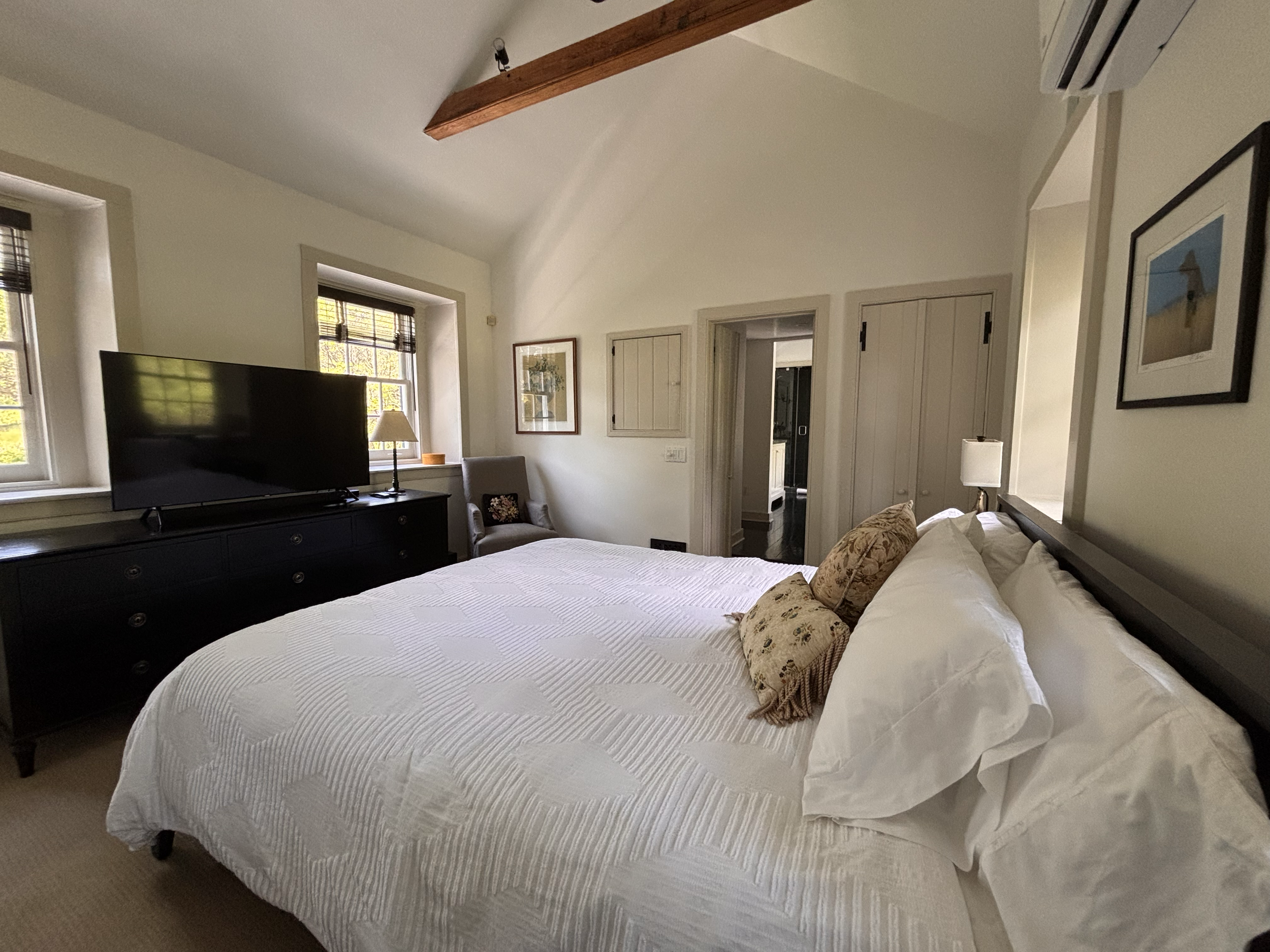 Master Bedroom with Cathedral Ceilings and Exposed Beams with Central AC and a 48-inch TV in Main House