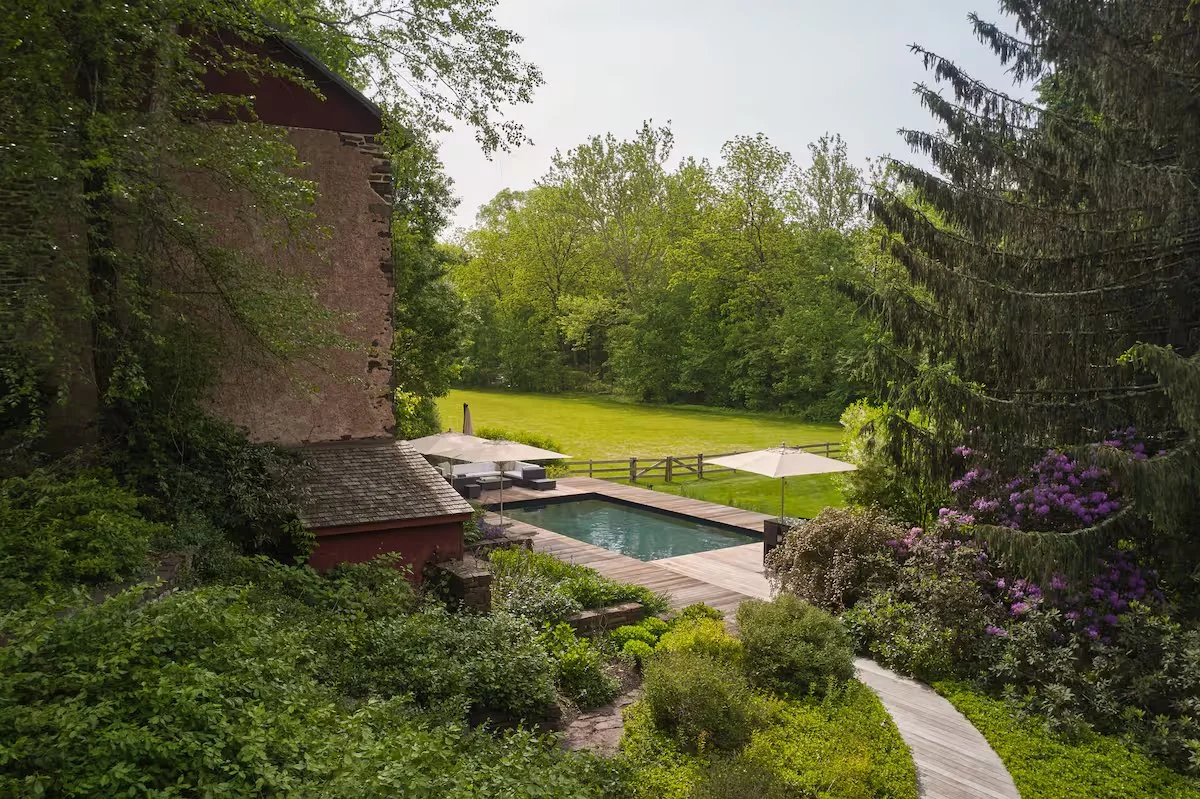 Walkway to Heated Pool and Antique Stone Barn with Garden