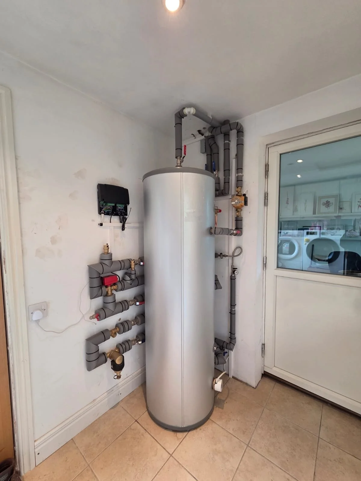 a new cylinder cupboard for a grant aeorana 290 heat pump, with their smart controller, diverter valve, and a spirotech dirt seperator