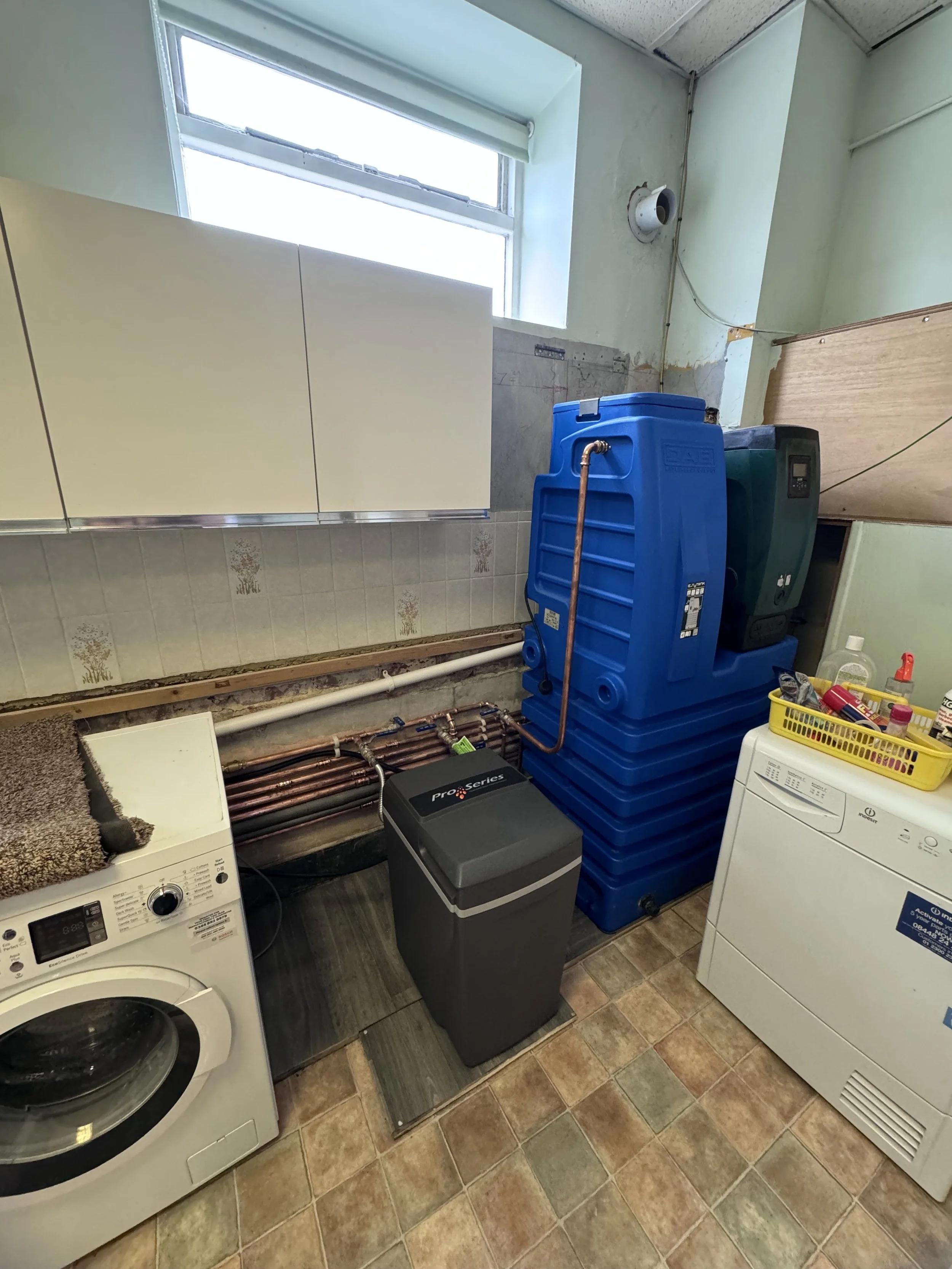 a laundry room with a esybox and dab tank mains water pressure boosting set, a great water water softner