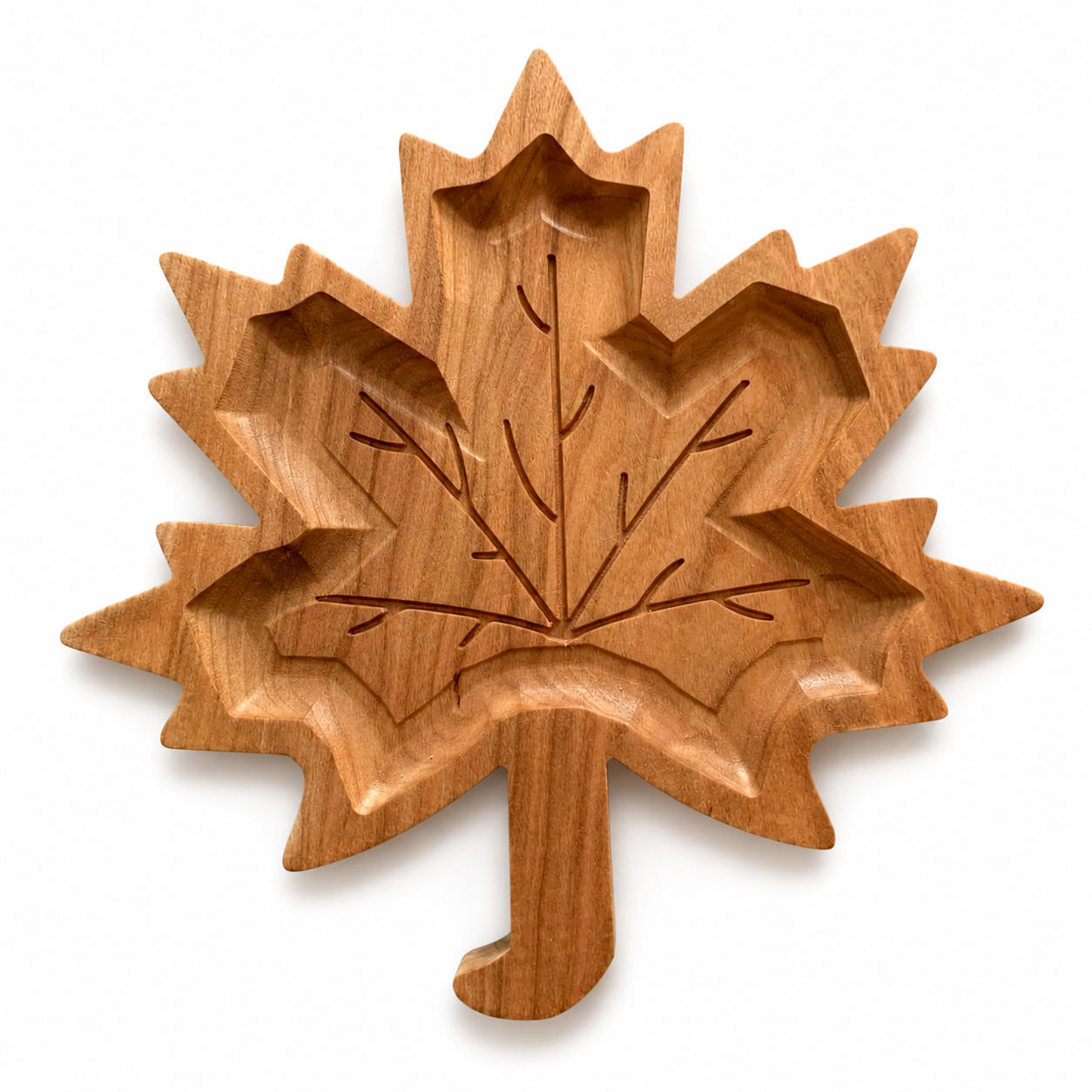 Wooden leaf-shaped dish with carved veins, designed for serving snacks or holding small items.