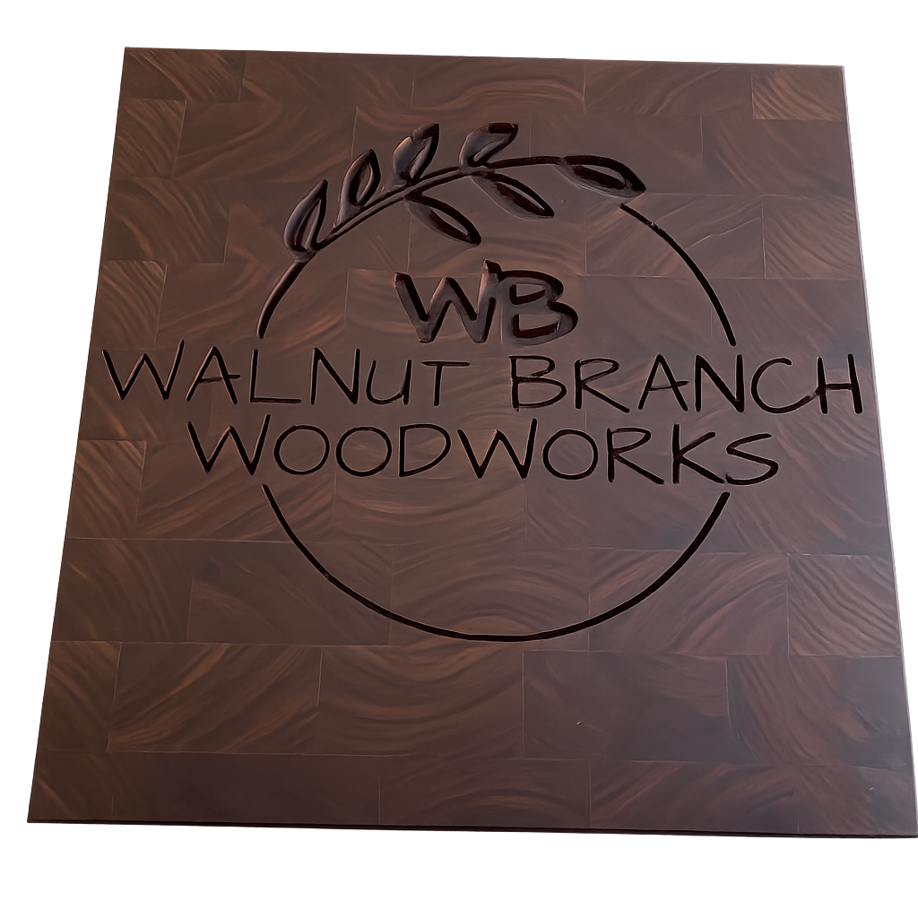 Sign with the logo of Walnut Branch Woodworks, featuring a leaf and branch design, with the initials 'WB' in the center.