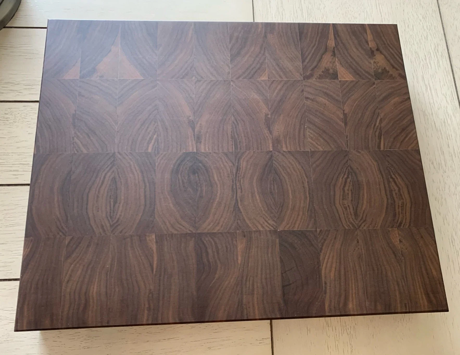 Close-up of intricately patterned wooden surface on a table.