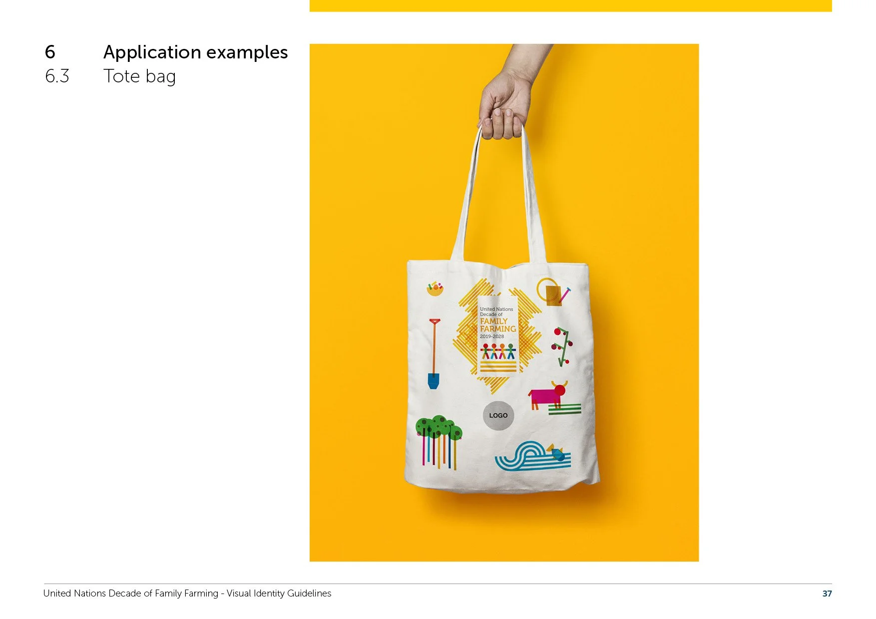 A tote bag with colorful illustrations of gardening tools, animals, and plants, and a label that reads 'United Nations Decade of Family Farming 2019-2028' being held by a hand against a yellow background.