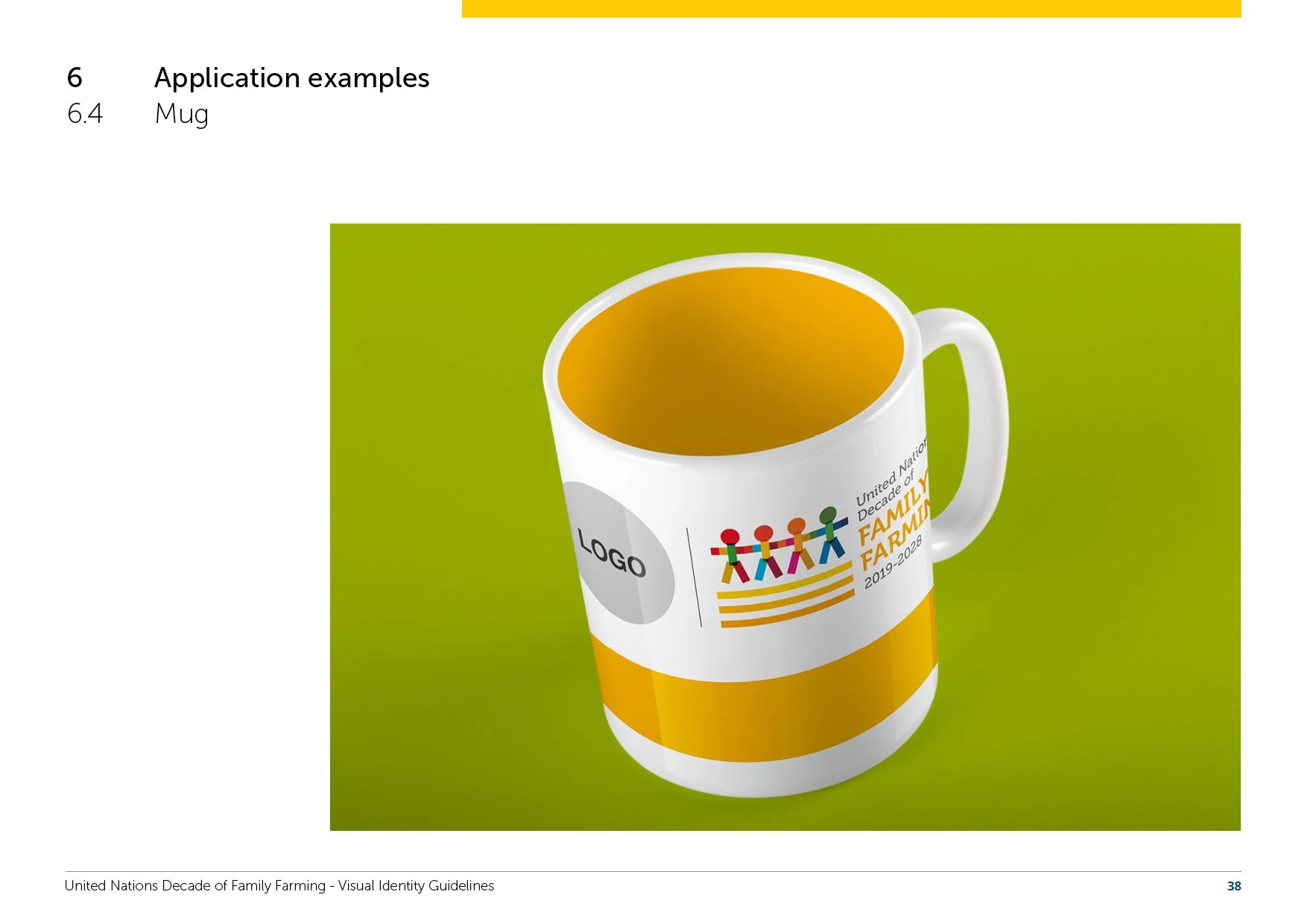 A white mug with a logo for United Nations Decade of Family Farming 2019-2028, featuring an illustration of five colorful figures holding hands on a green background