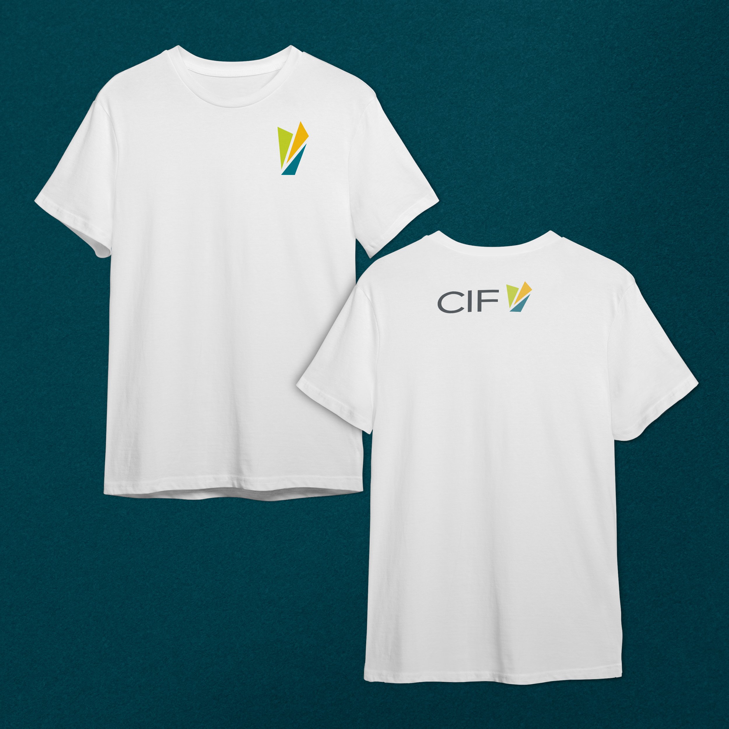 Two white t-shirts hanging against a teal background. The t-shirt on the left displays a colorful abstract design with green, yellow, orange, and blue shapes. The t-shirt on the right has partially visible text, with the letters 'CIF' showing.
