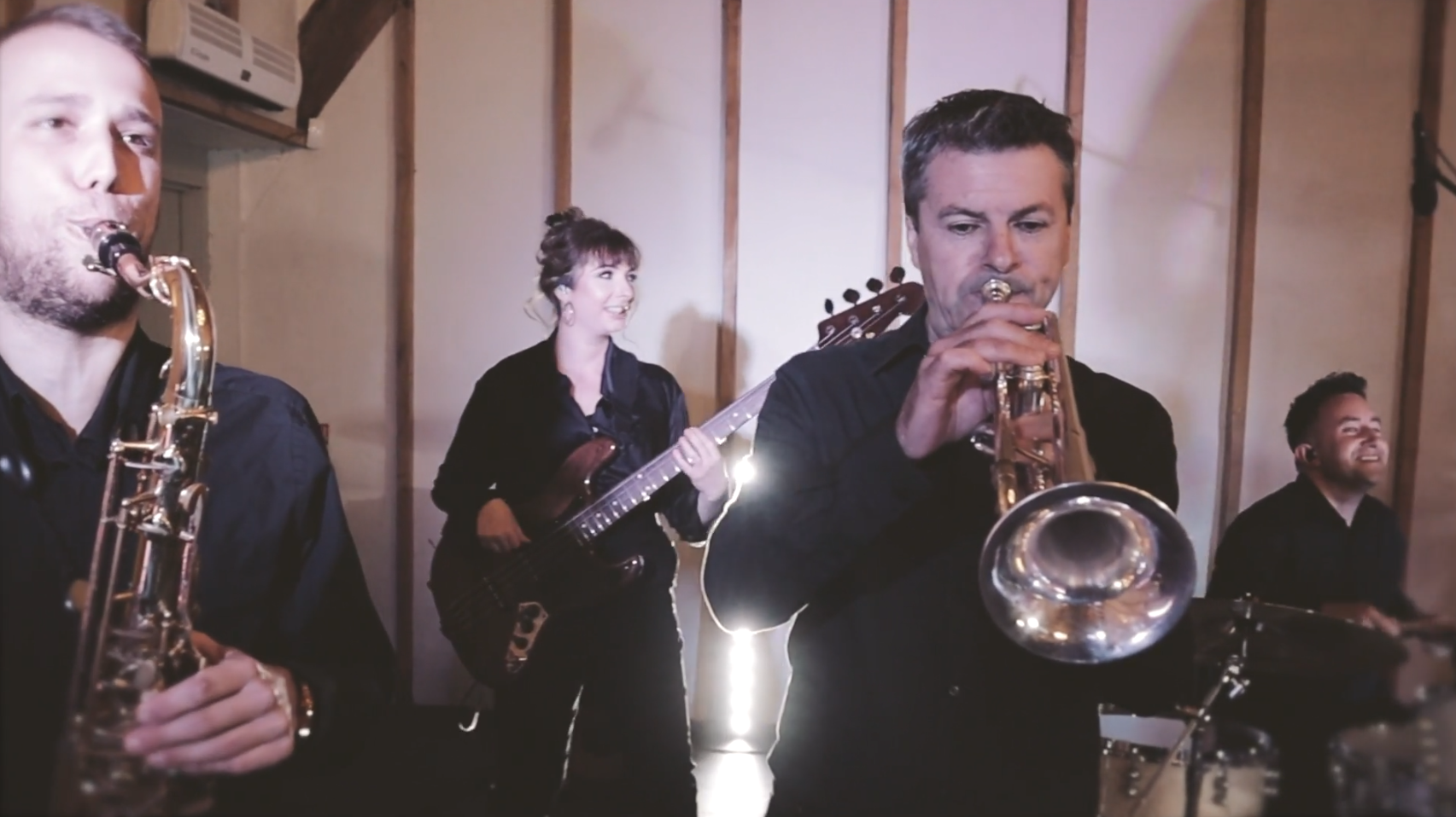 Exclusiv horn section trio playing trumpet and saxophones