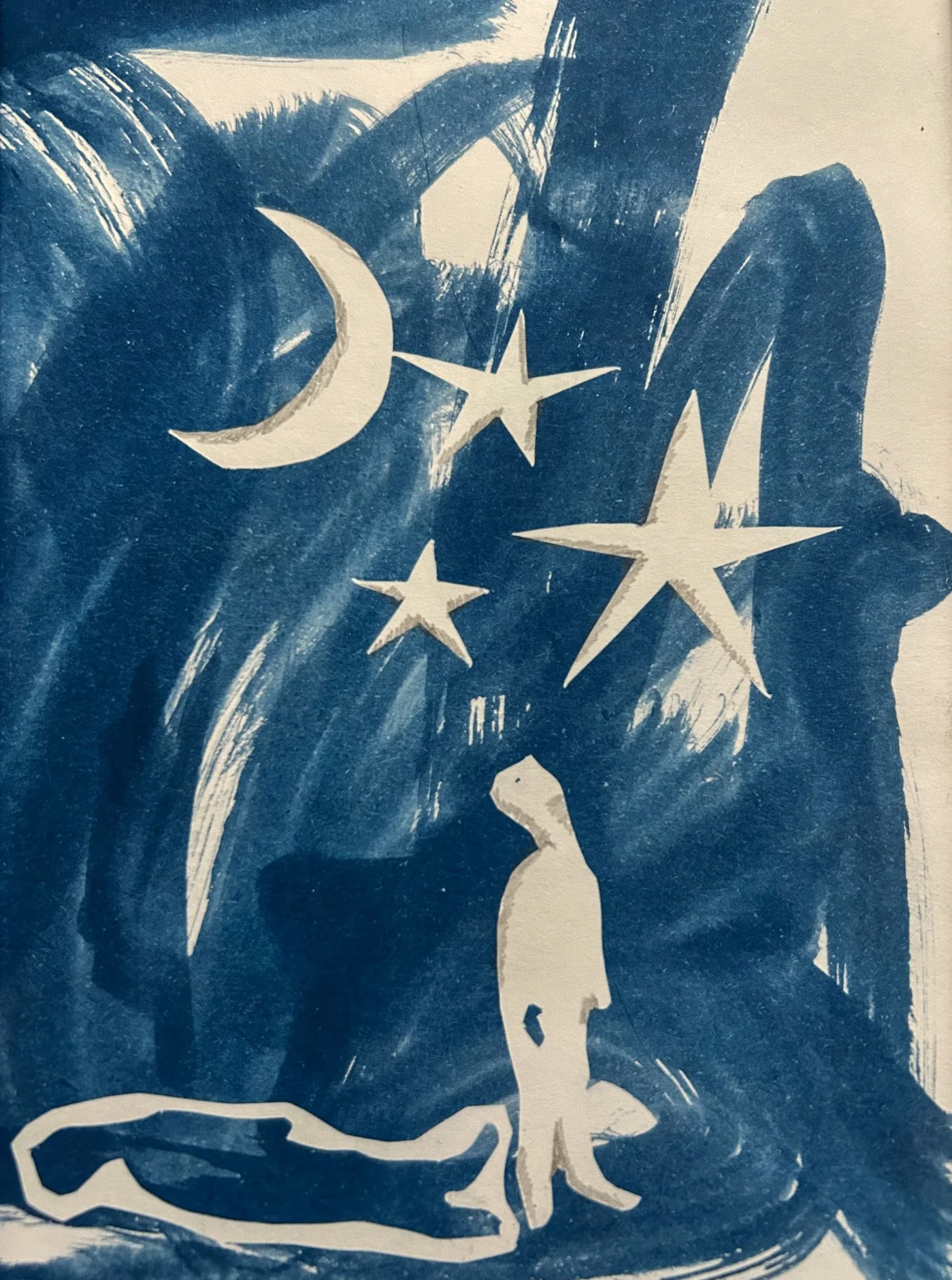 cyanotype print hand cut shapes person and night sky