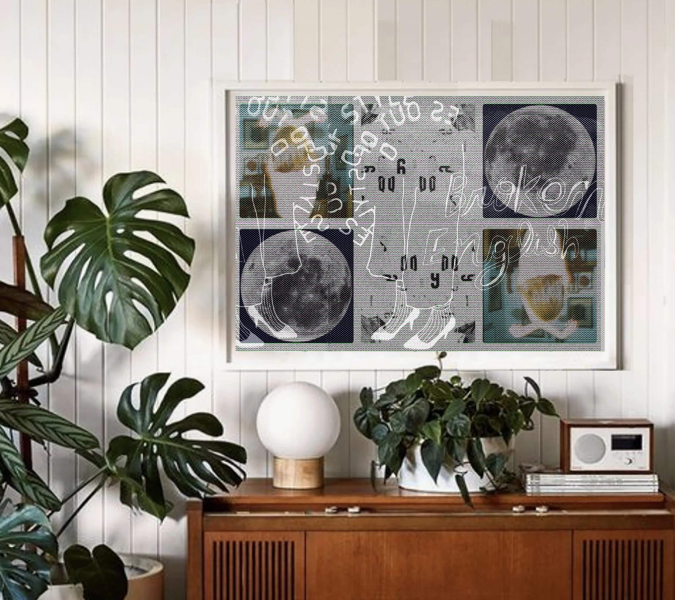 Living room with white wooden panel wall, framed abstract art, potted plants, a white spherical lamp on a wooden table, and a wooden cabinet with photos and decor.