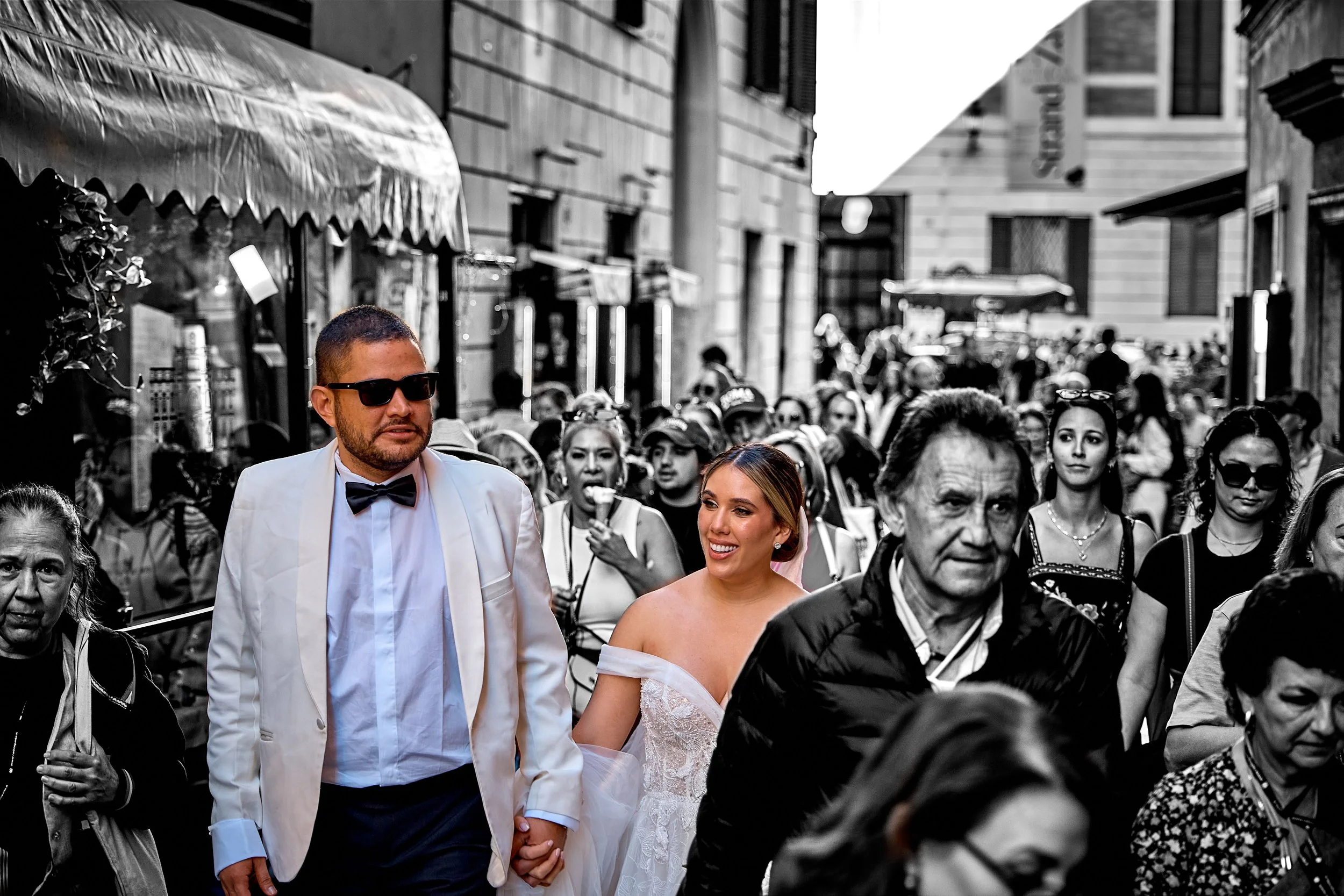 Couple walking a lively Rome street after their elopement — Rome Luxury Elopements