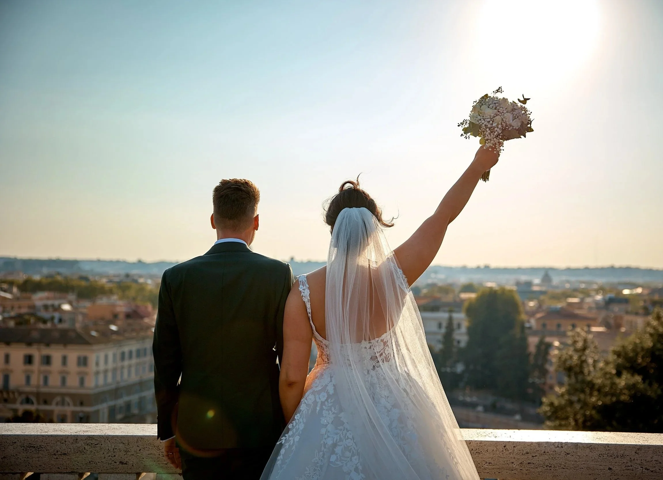 Joyful couple celebrating their elopement in Rome at sunset — Rome Luxury Elopements