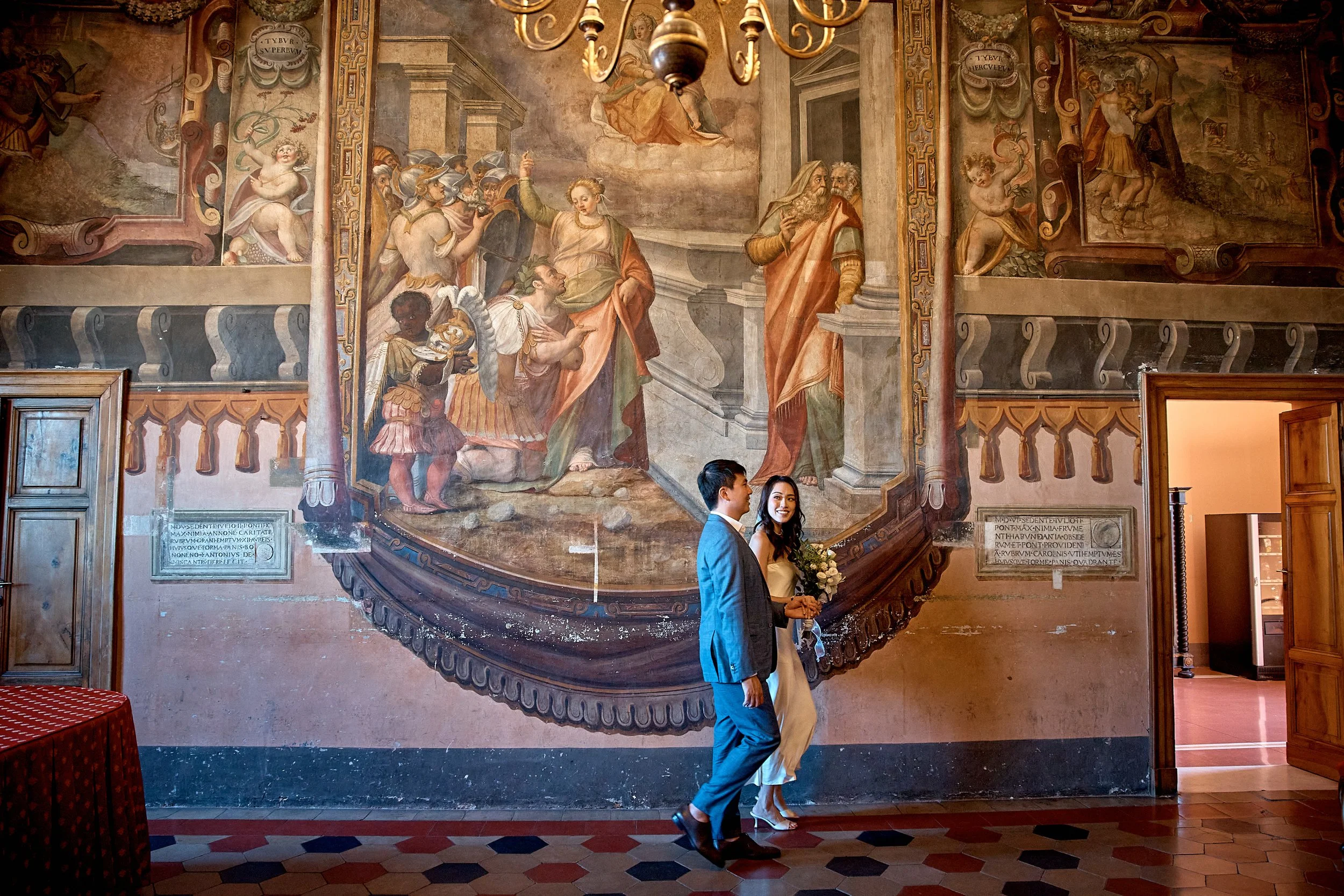 Groom by a Renaissance fresco at a Rome elopement — Rome Luxury Elopements