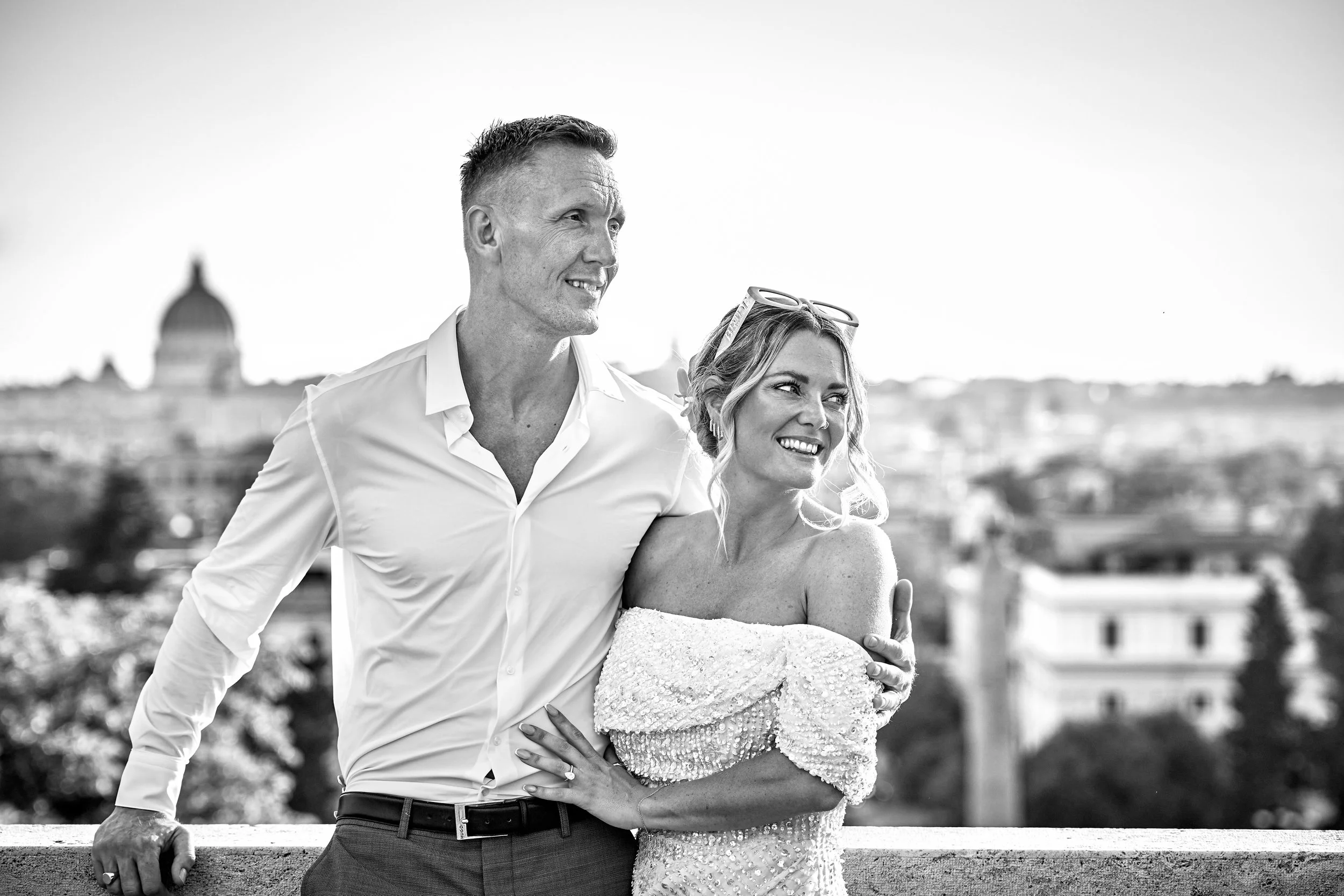 Couple embracing on a panoramic Rome terrace elopement — Rome Luxury Elopements