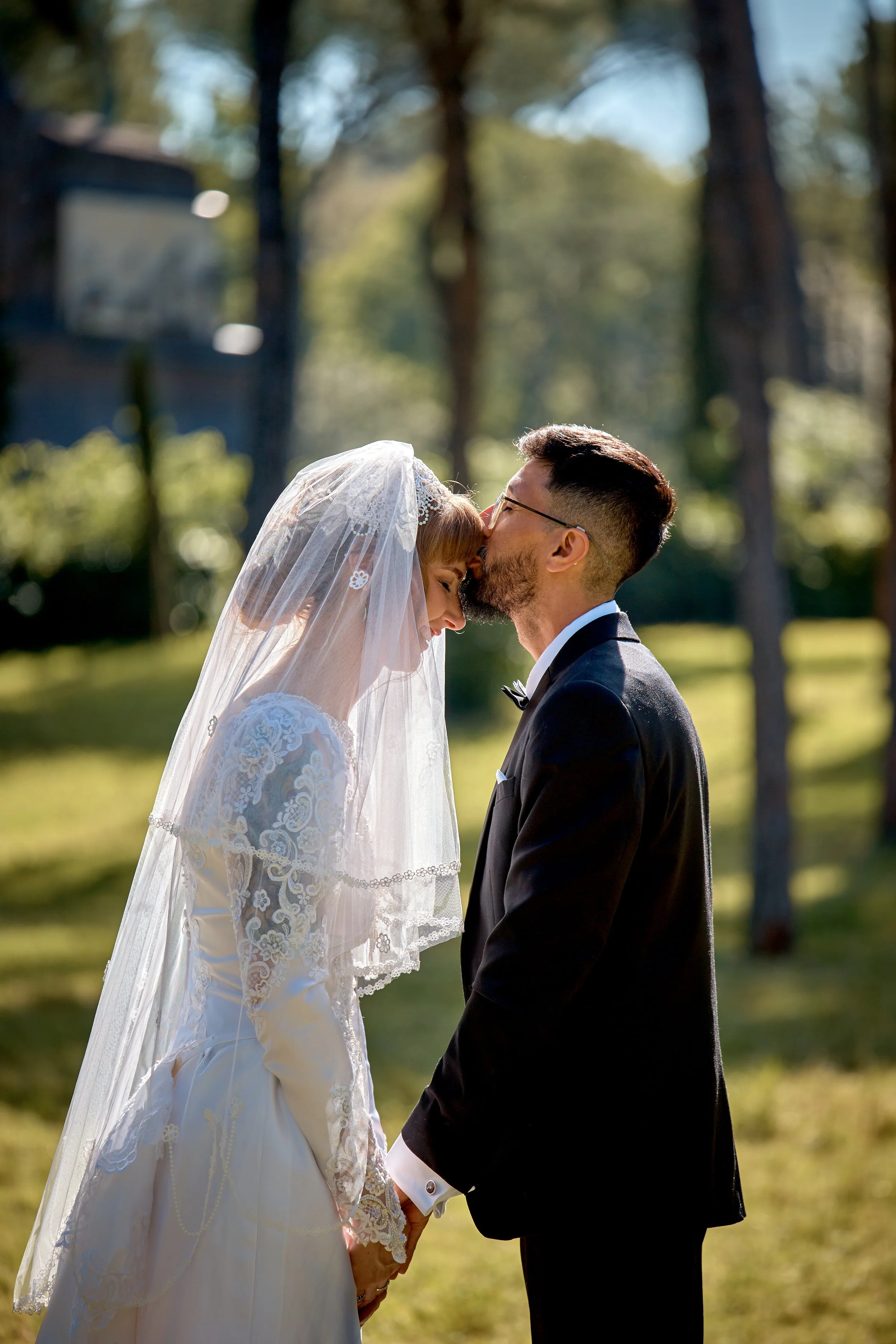 Couple kissing beneath the veil at a Rome garden elopement — Rome Luxury Elopements