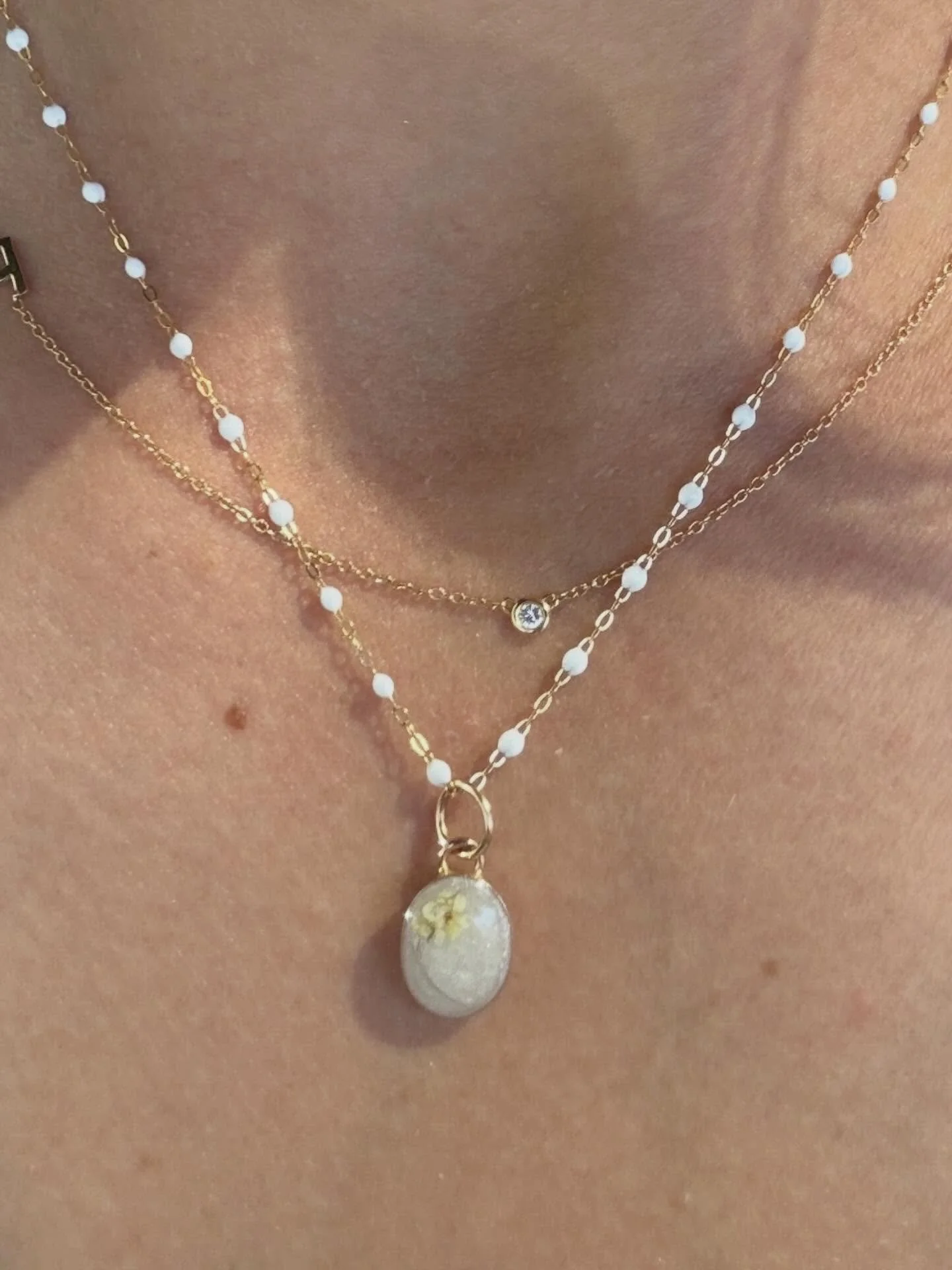 Breastmilk Keepsake Necklace Pendant with baby hair and tiny flower accent. 

@daniellehaft 

#keepsakejewelry #breastmilk #babyhair #breastfeeding #southbay