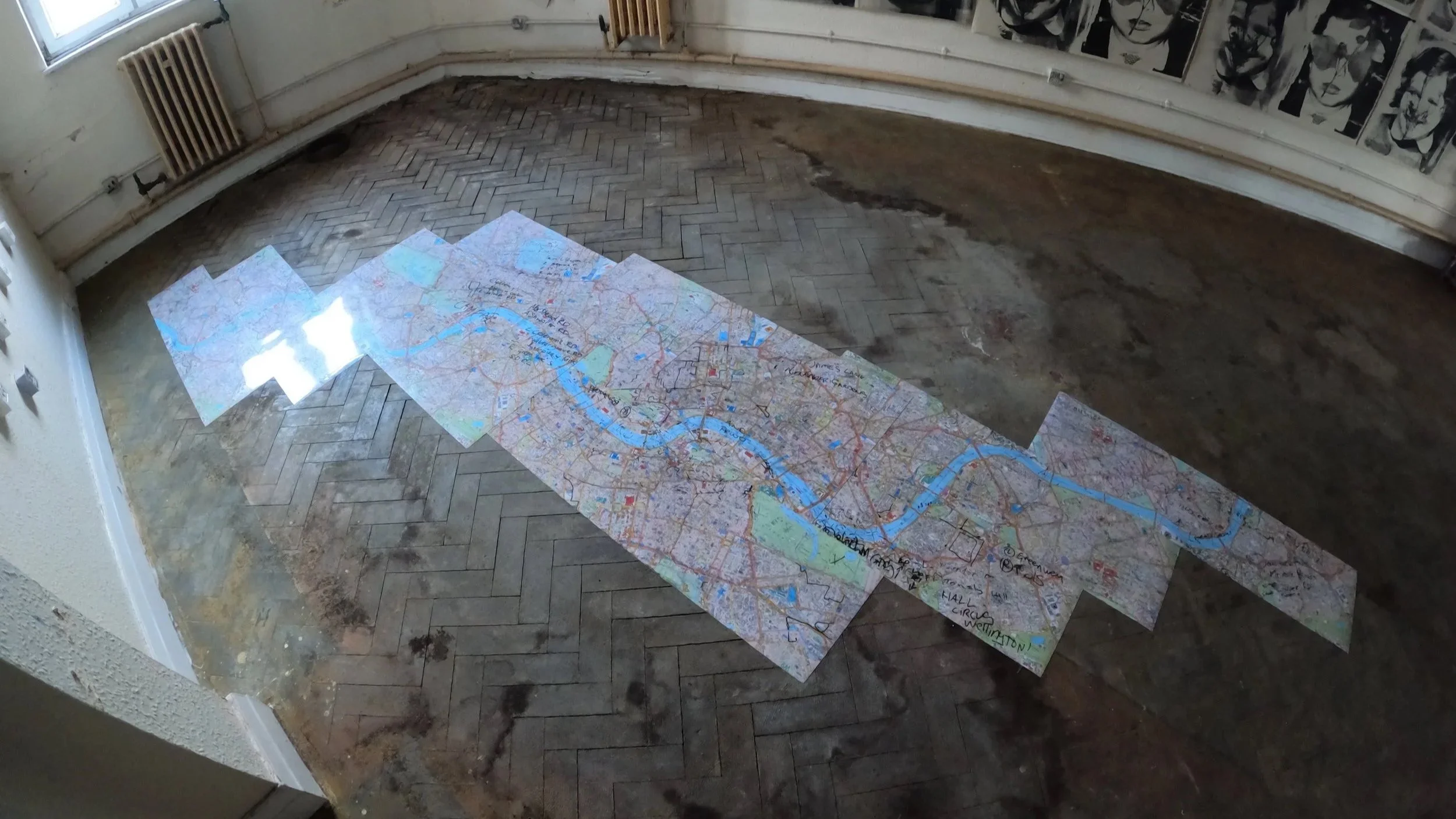 An abandoned daycare outside London, UK now repurposed for artistic production. The facility formerly was a training site for taxi drivers and there are maps on the floor used to teach "the knowledge".