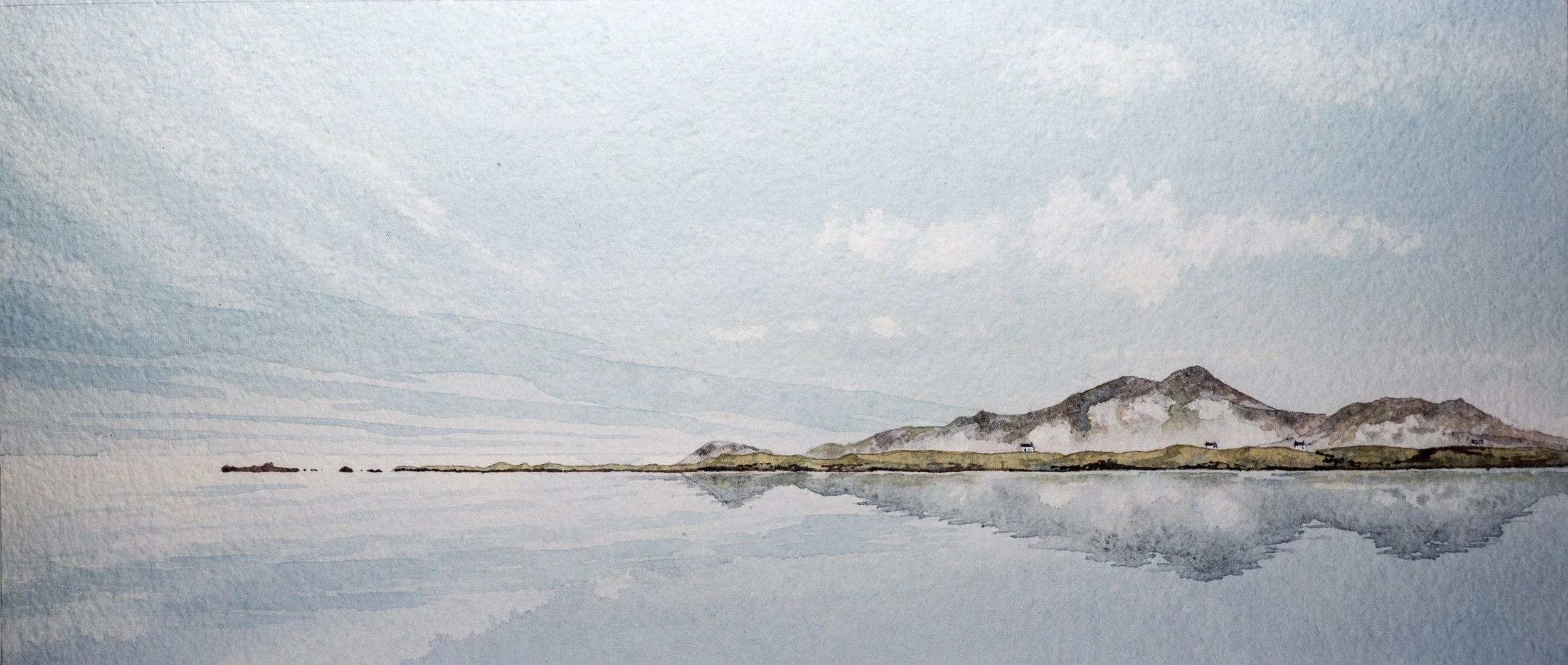 islands reflected in a calm sea