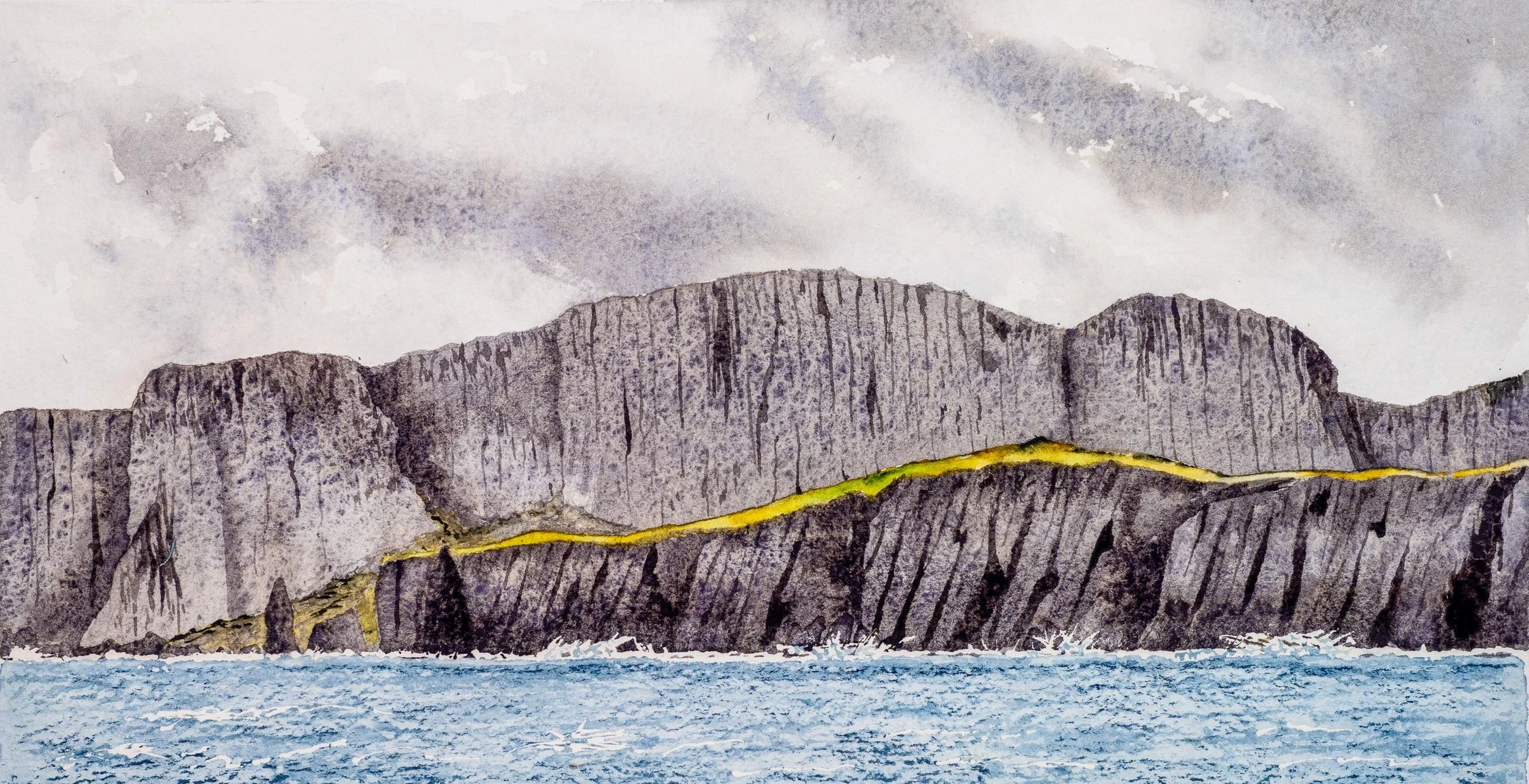 sea cliffs with near vertical pillars in the rock