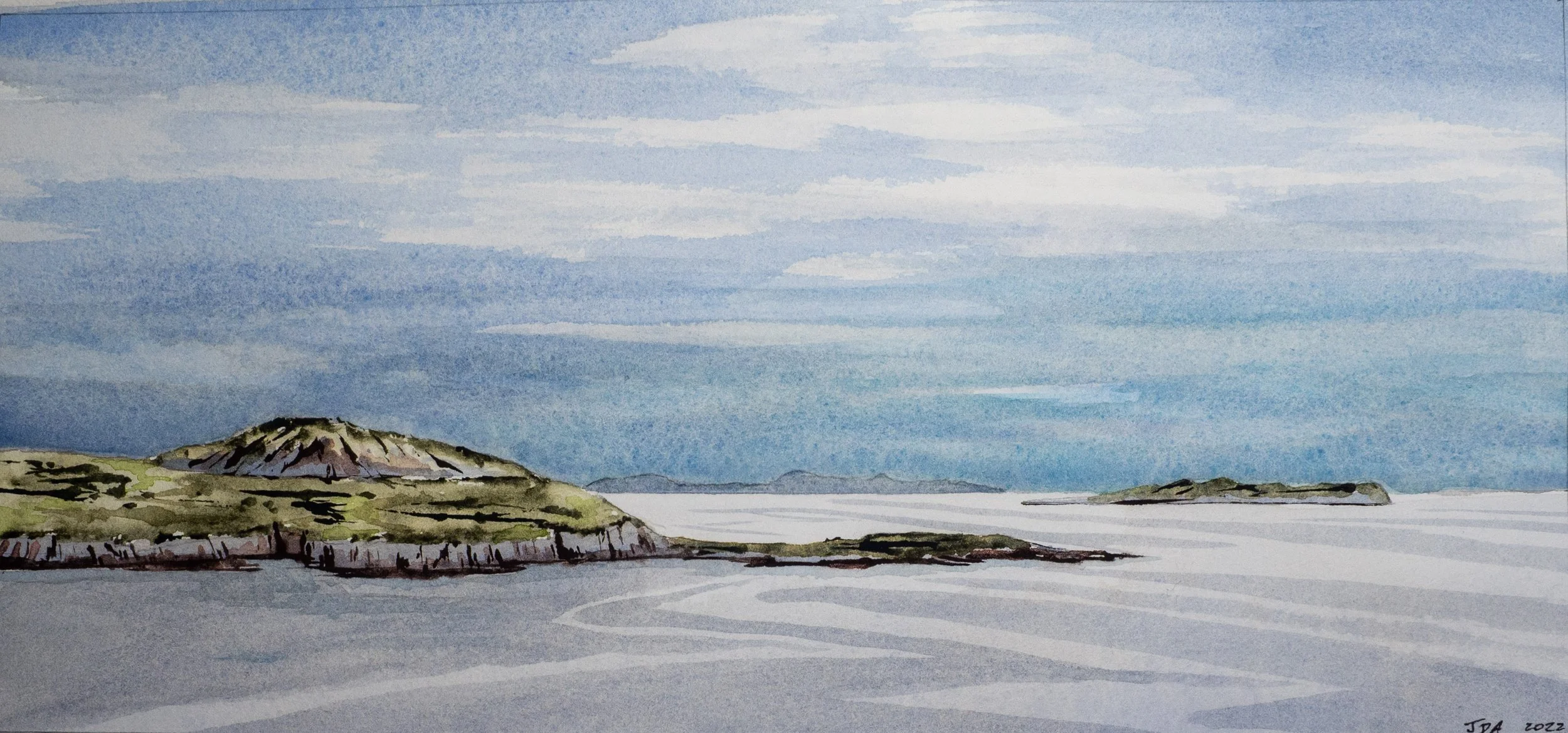 rocky headland in a calm sea