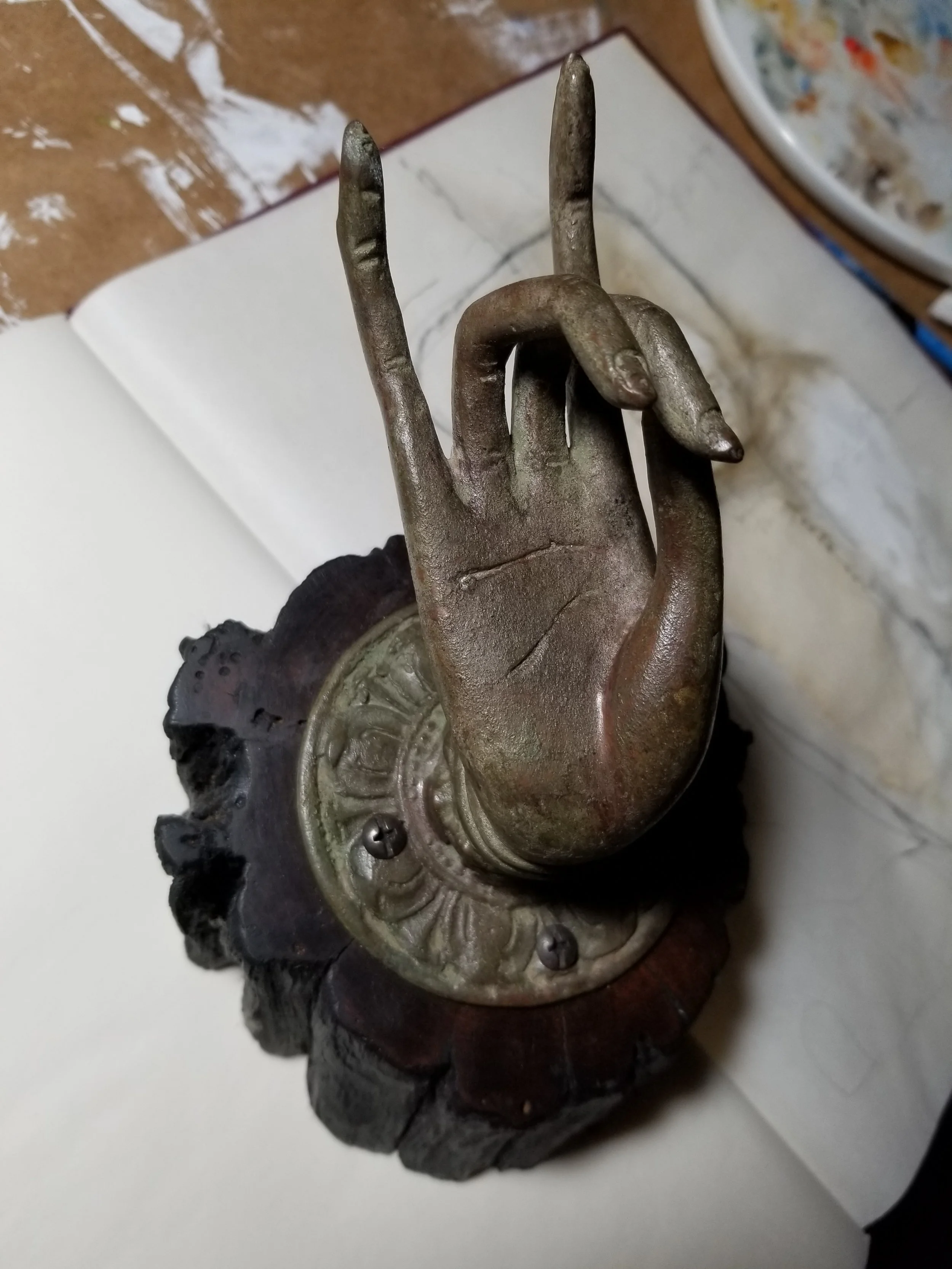 Bronze Buddha Hand on Reclaimed Wood