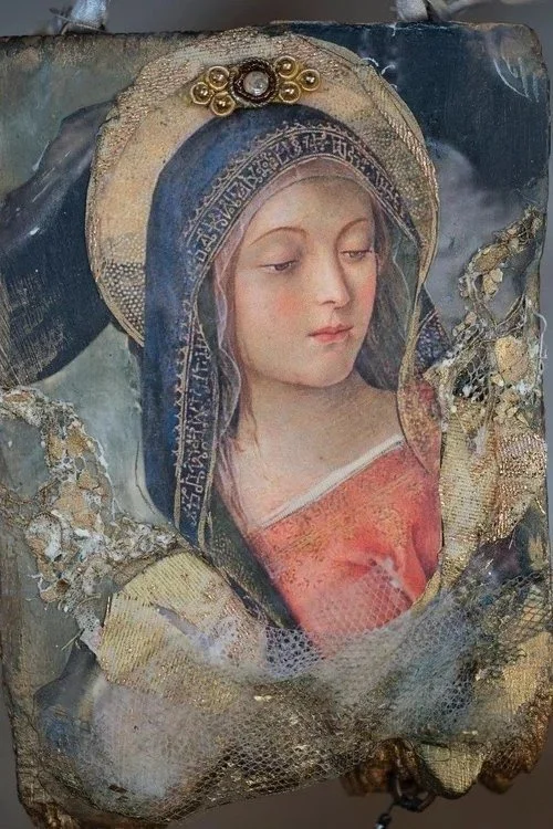 A damaged, aged religious icon painting of a woman with a halo, wearing a blue head covering and a red garment, with visible cracks and gold embellishments.
