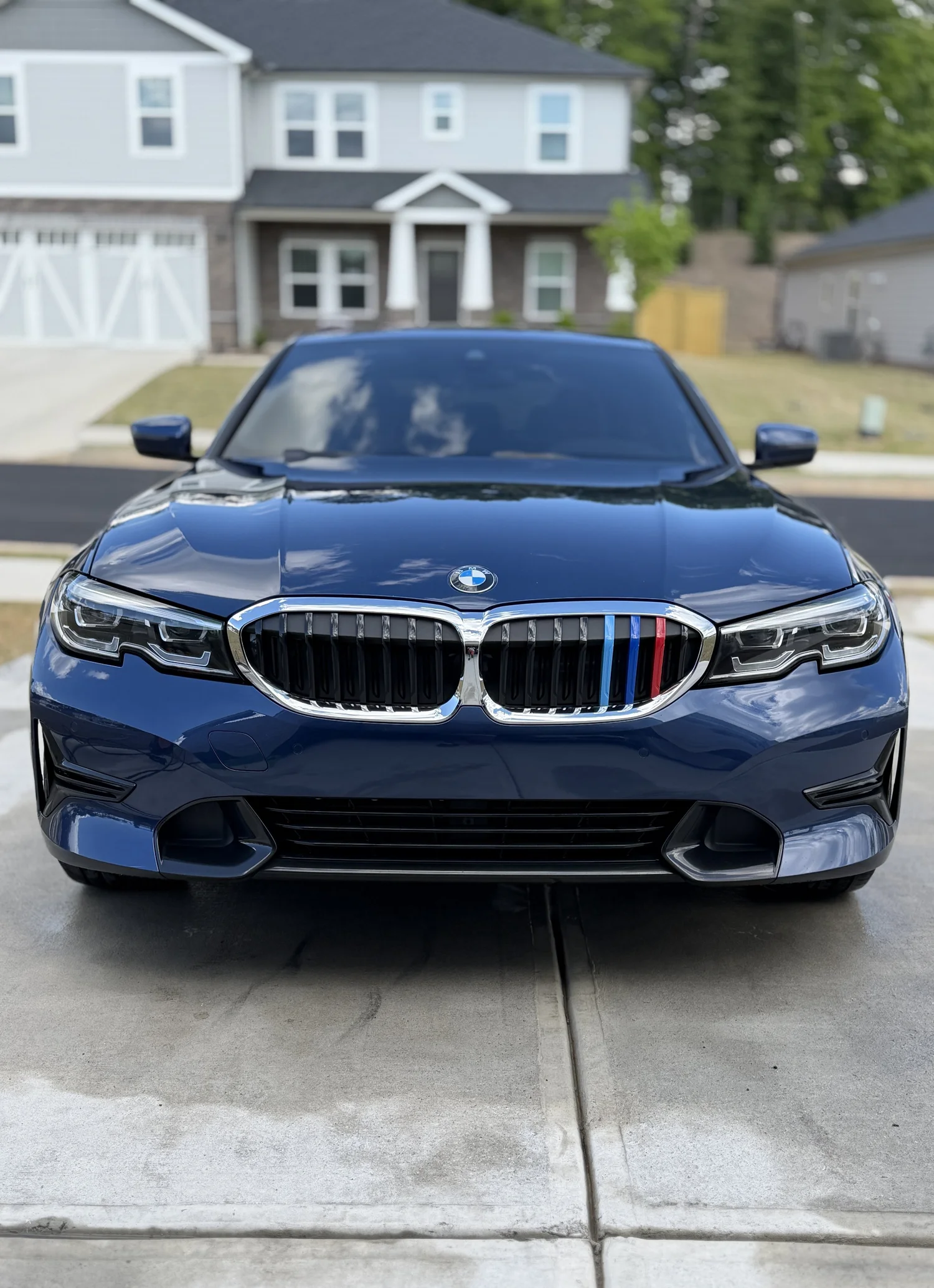 The same blue BMW 3 Series after the detail