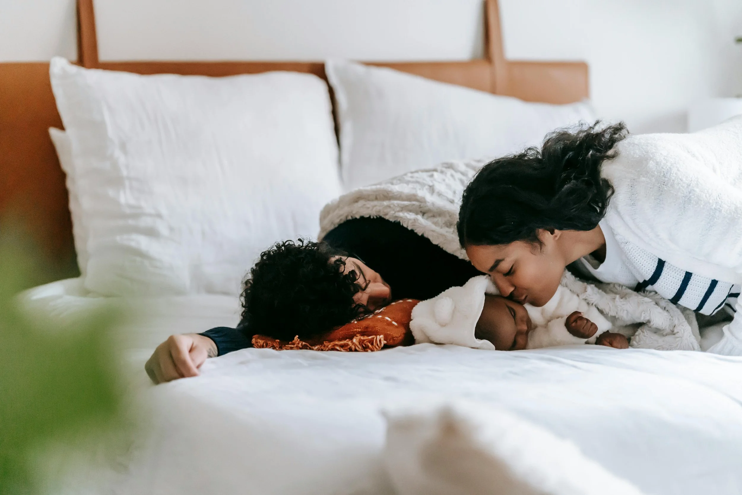 a new family relaxing and enjoying their fourth trimester with their newborn after receiving postpartum support in san diego