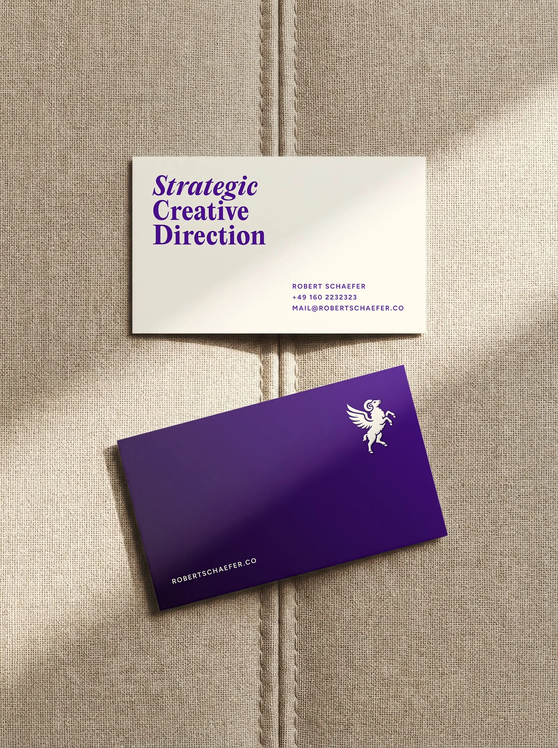 Business cards of Robert Schaefer offering Strategic Creative Direction