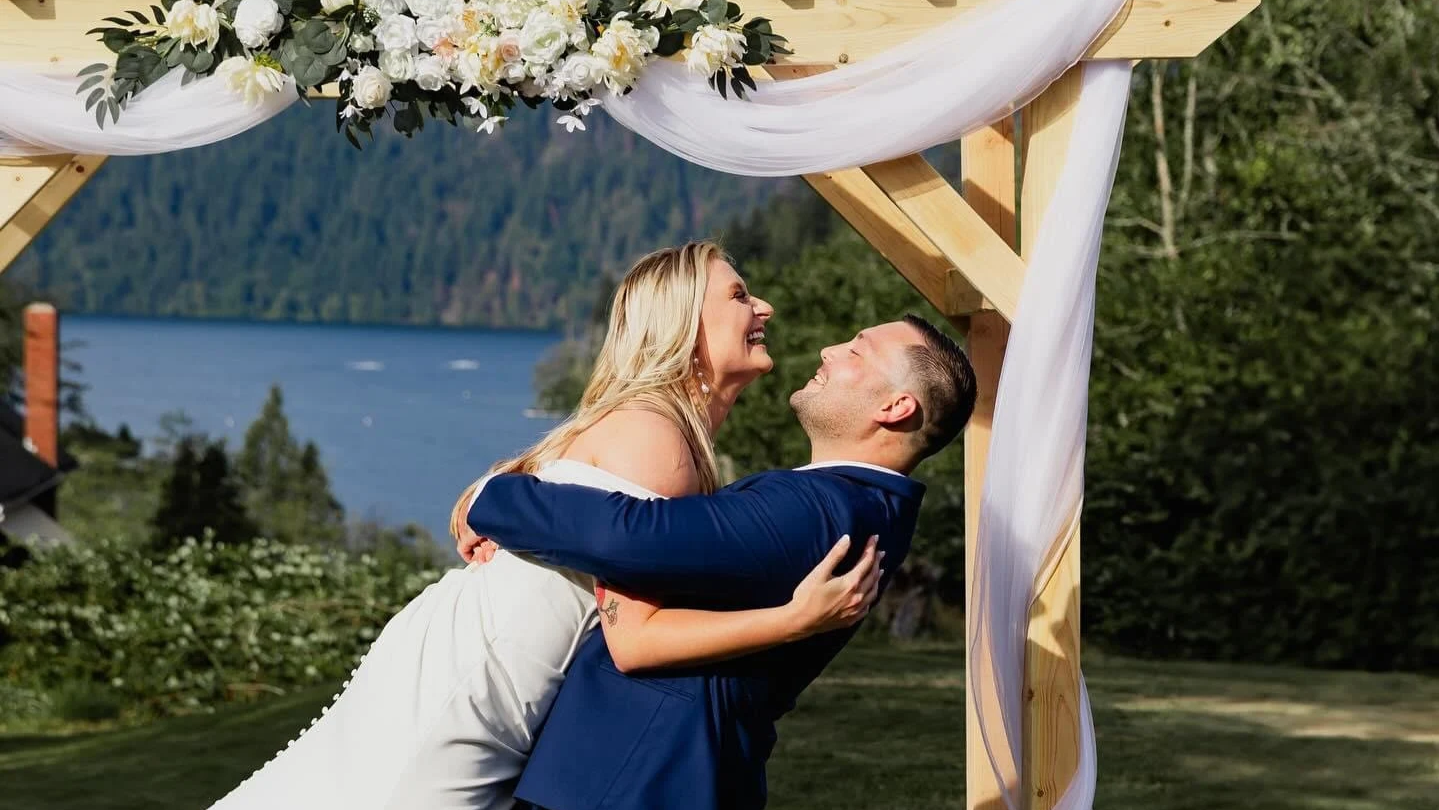 Laurie’s customers, Evan and Kade, running down a mountain after getting married. 