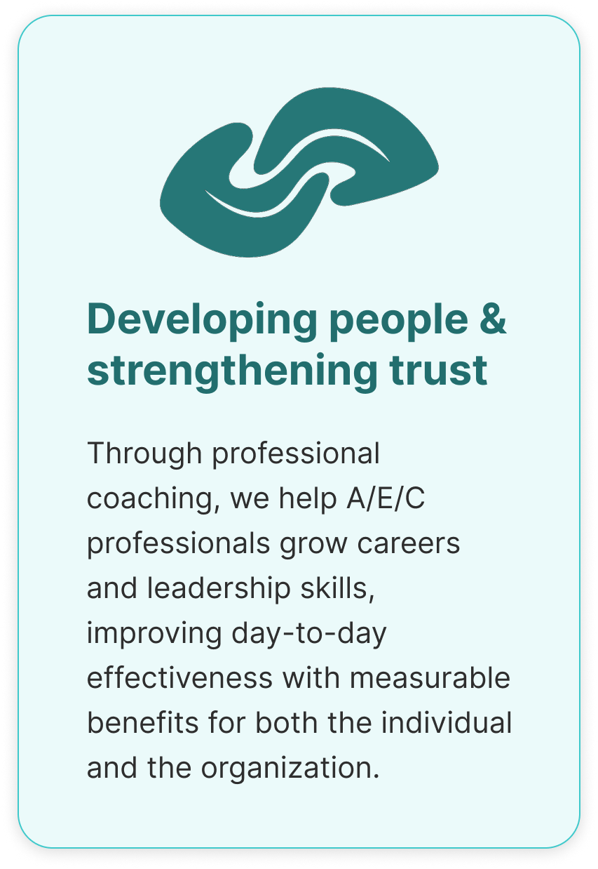 A teal-colored sign with a logo of two interlinked hands at the top, and text that reads: 'Developing people & strengthening trust. Through professional coaching, we help A/E/C professionals grow careers and leadership skills, improving day-to-day effectiveness with measurable benefits for both the individual and the organization.'