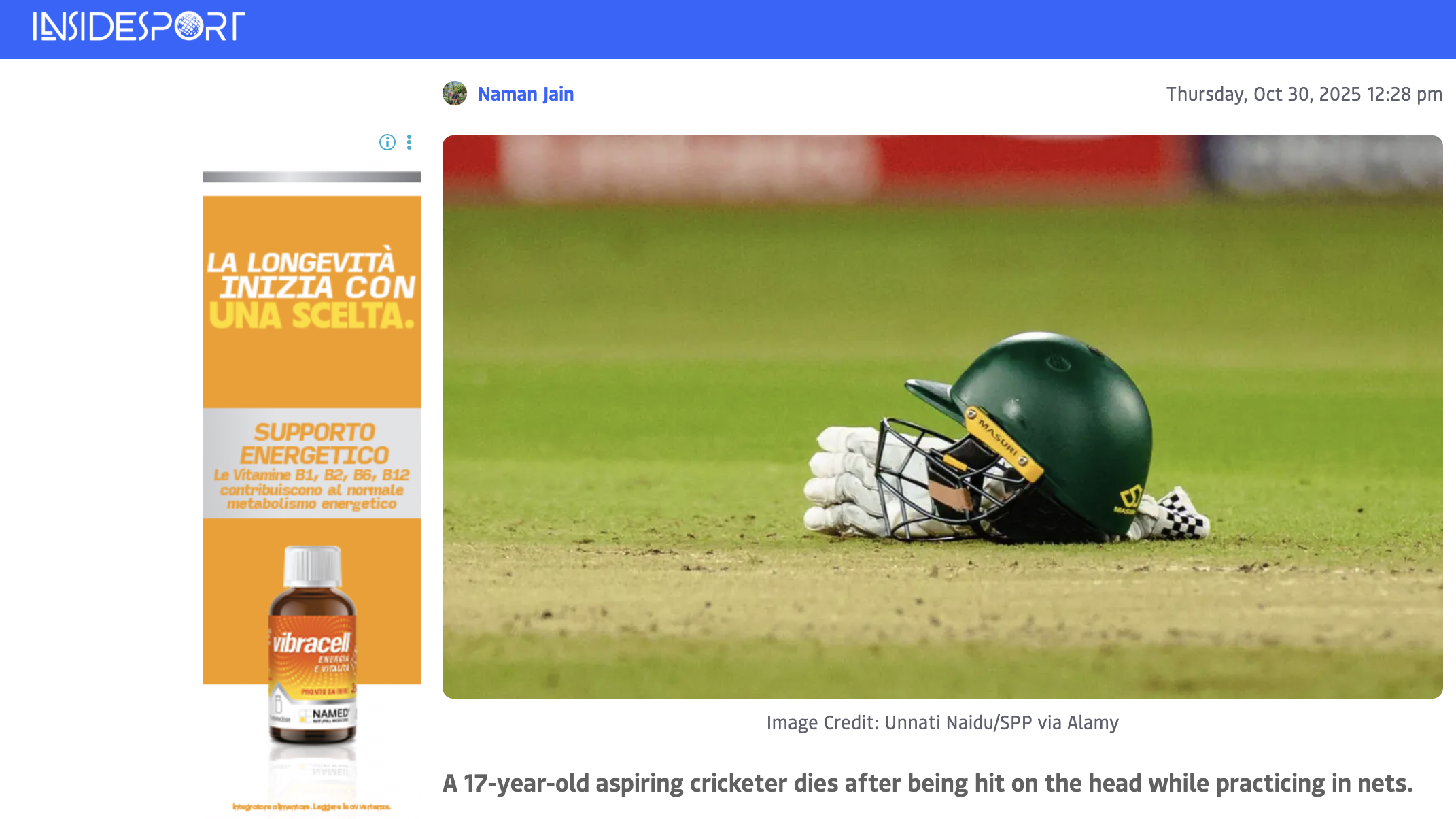 A green cricket helmet and a pair of white cricket gloves are lying on the ground on a cricket field.