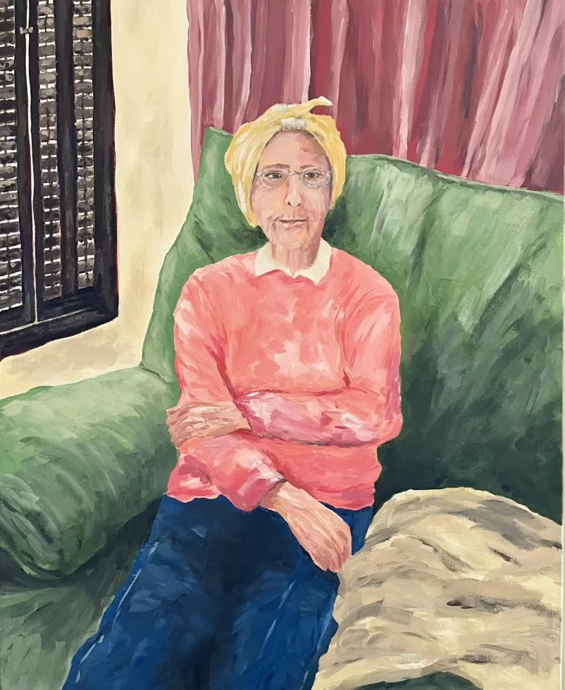 A painting of an elderly woman with glasses, hair in a headscarf, sitting on a green couch with arms crossed, wearing a pink sweater and dark blue pants, in a room with pink curtains and a window with black bars, painted by artist, Karen Serago.